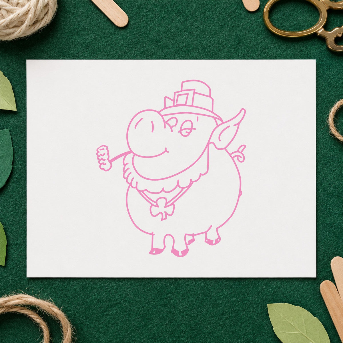 Irish Pig with Shamrock Rubber Stamp impression in pink ink on white paper in a styled craft setting.