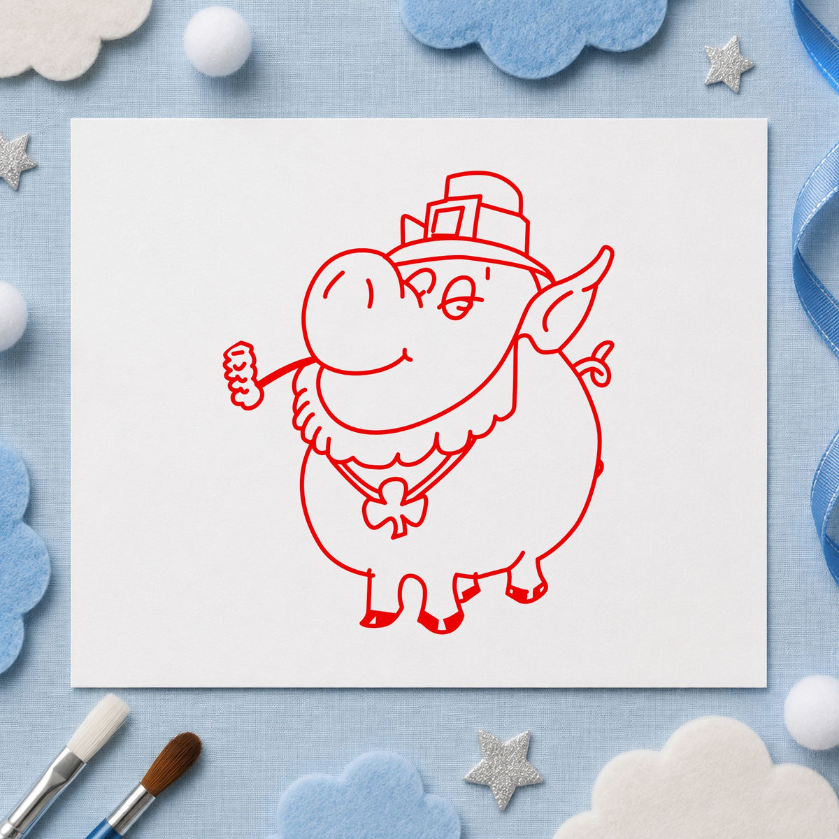 Irish Pig with Shamrock Rubber Stamp impression in red ink on white paper in a styled craft setting.