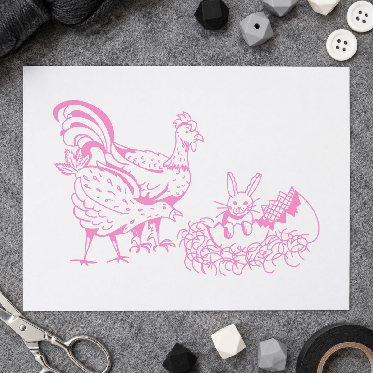 Chickens and Bunny in Easter Egg Rubber Stamp impression in pink ink on white paper in a styled craft setting.