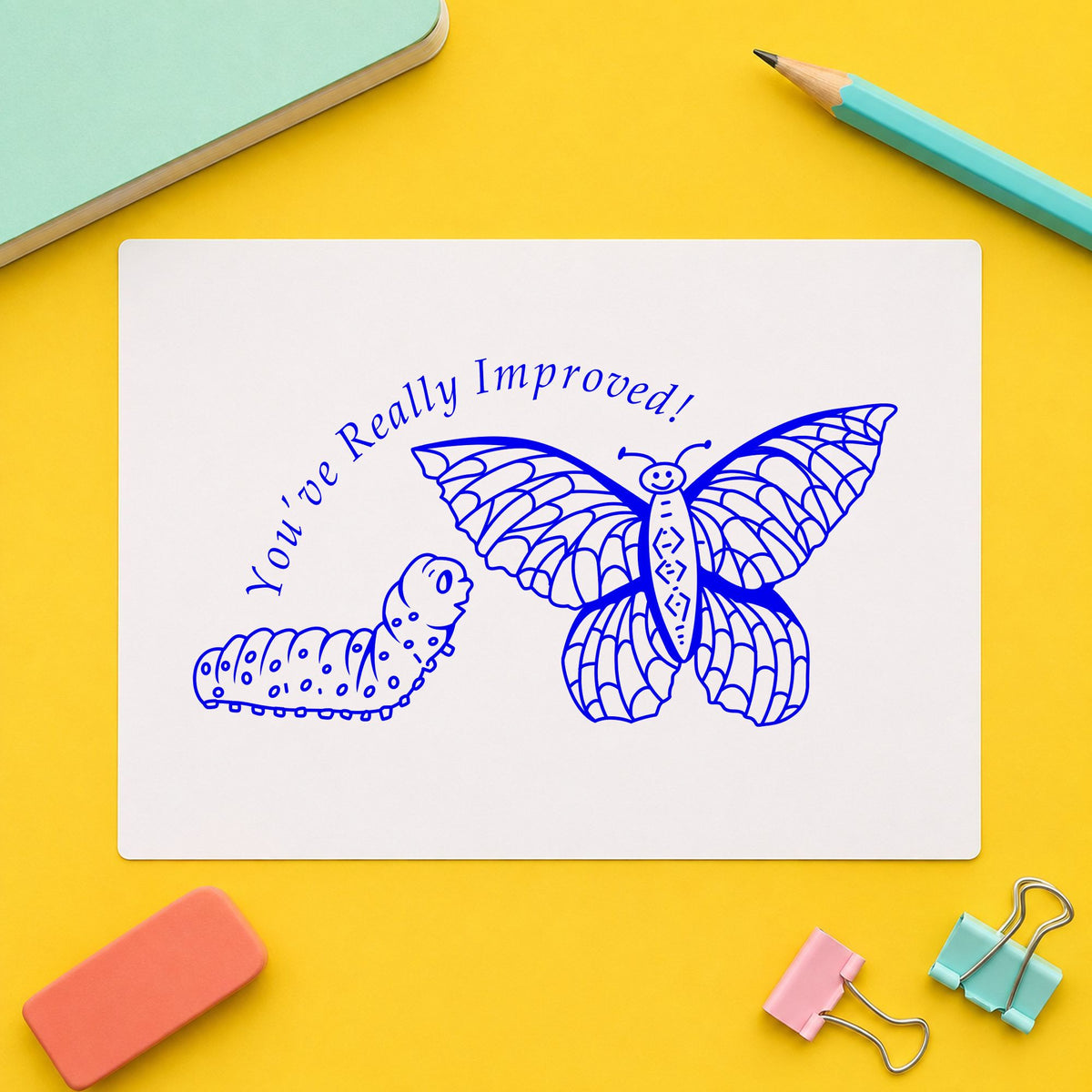 Blue butterfly rubber stamp impression featuring the youve really improved butterfly and caterpillar design on white paper.