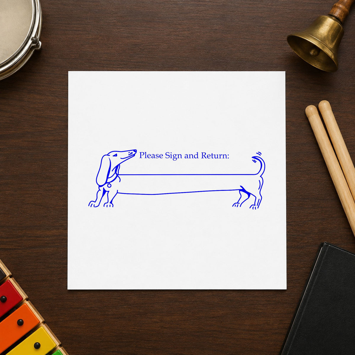 Blank Award Ribbon Rubber Stamp impression in blue ink on white paper in a styled craft setting.