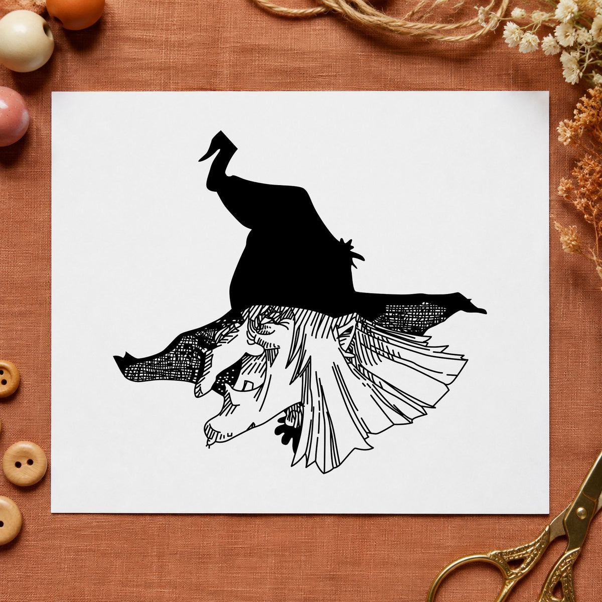 Witch Head with Hat Rubber Stamp impression in black ink on white paper in a styled craft setting.