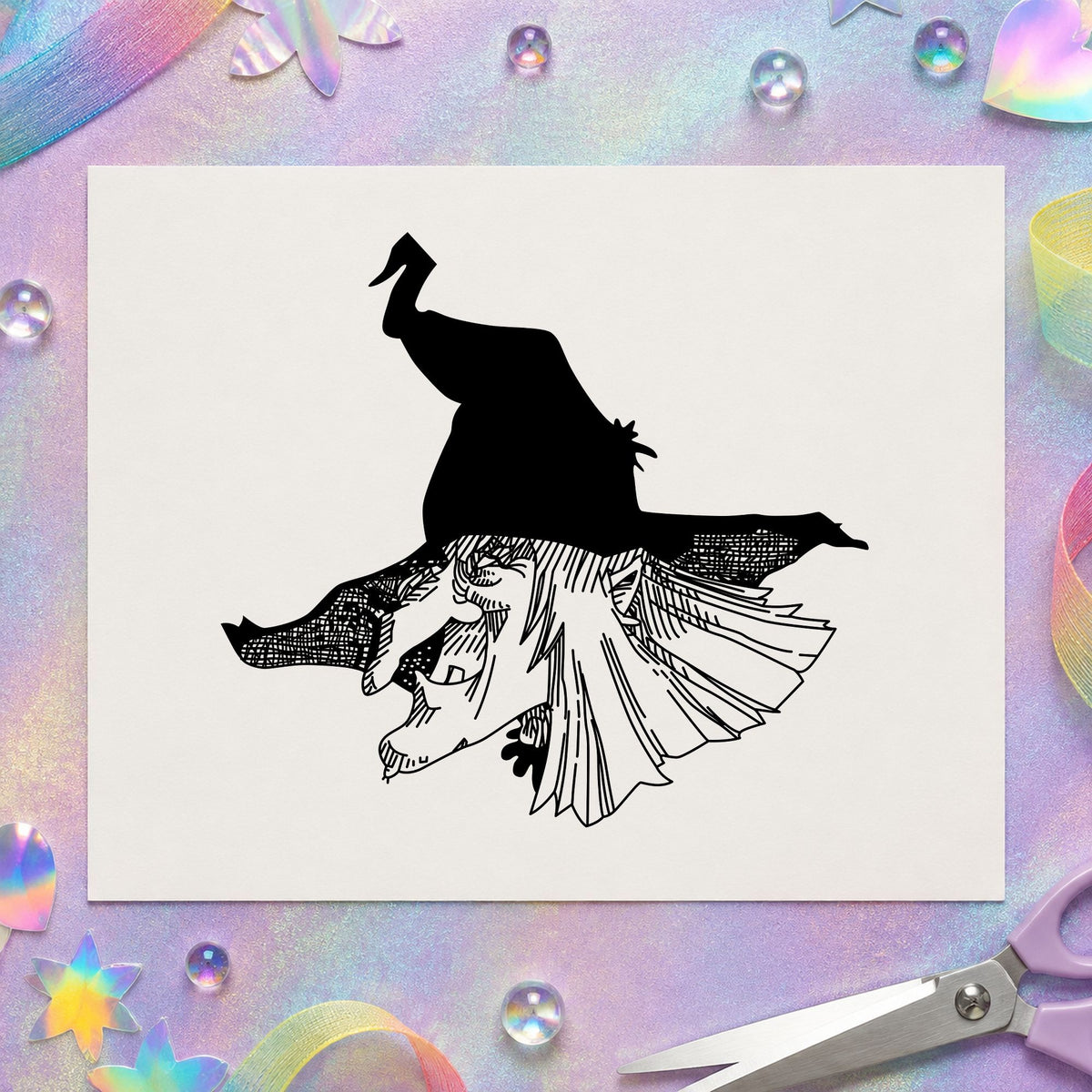 Black impression from a witch rubber stamp, featuring the witch head with hat design on white paper.