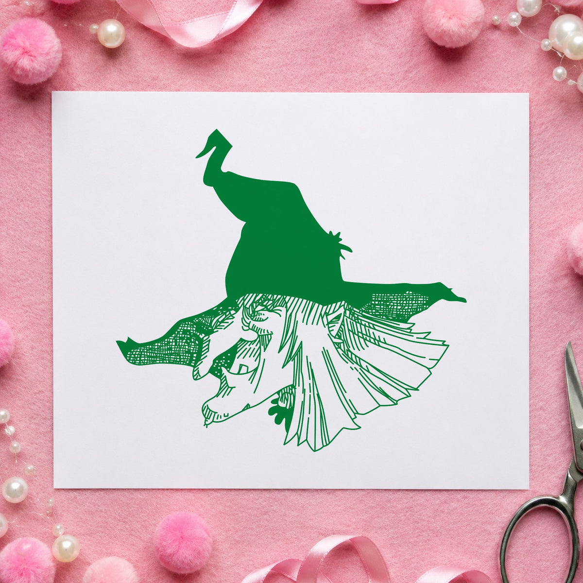 Witch Head with Hat Rubber Stamp impression in green ink on white paper in a styled craft setting.