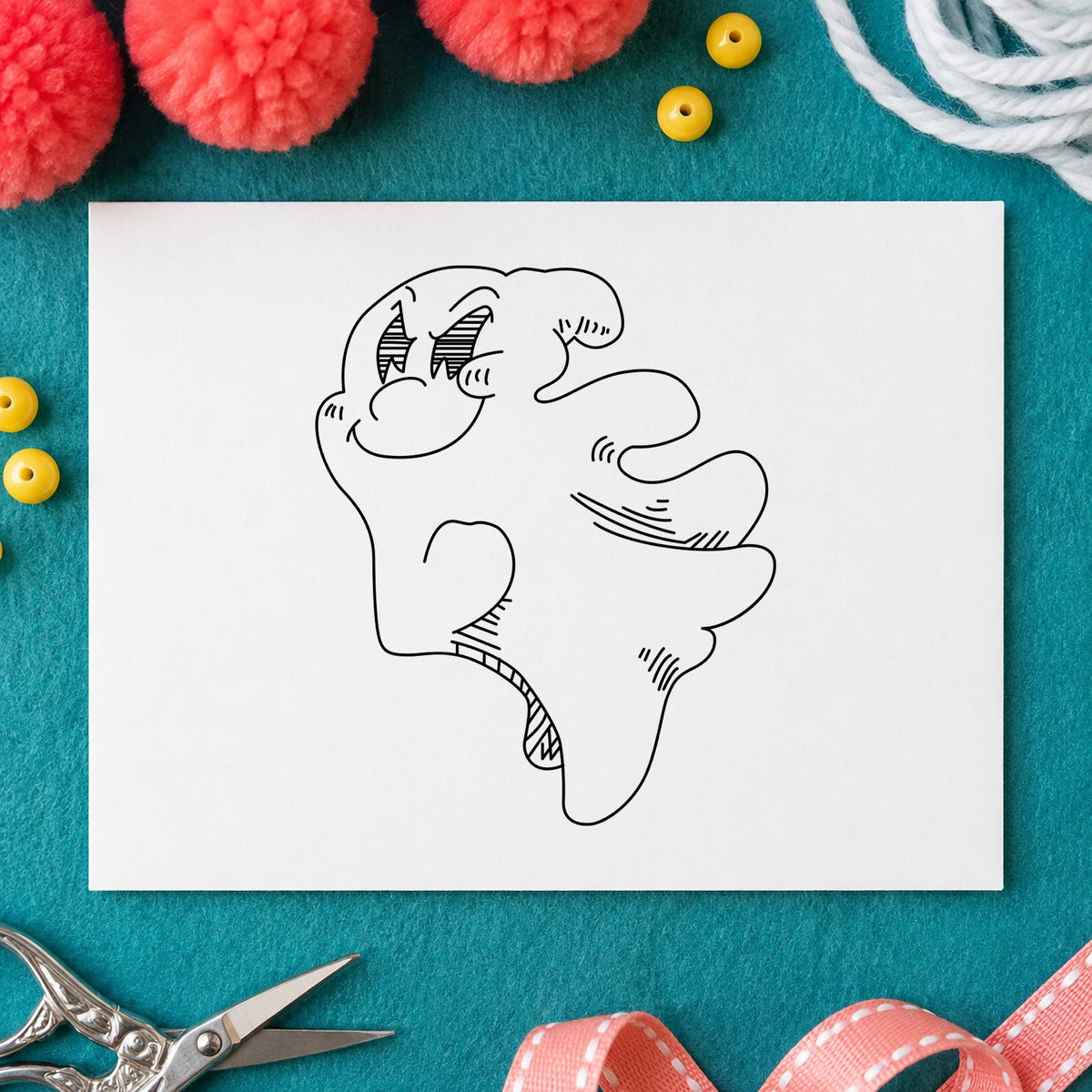 Friendly Smiling Ghost Rubber Stamp impression in black ink on white paper in a styled craft setting.