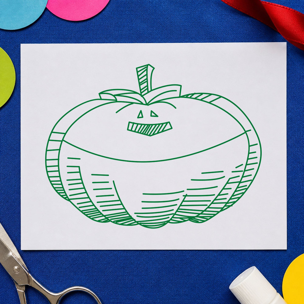 Smiling Jacko Lantern Rubber Stamp impression in green ink on white paper in a styled craft setting.