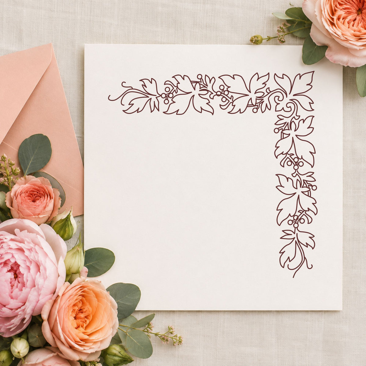 Open Leaf Corner Border Rubber Stamp impression in brown ink on white paper in a styled craft setting.