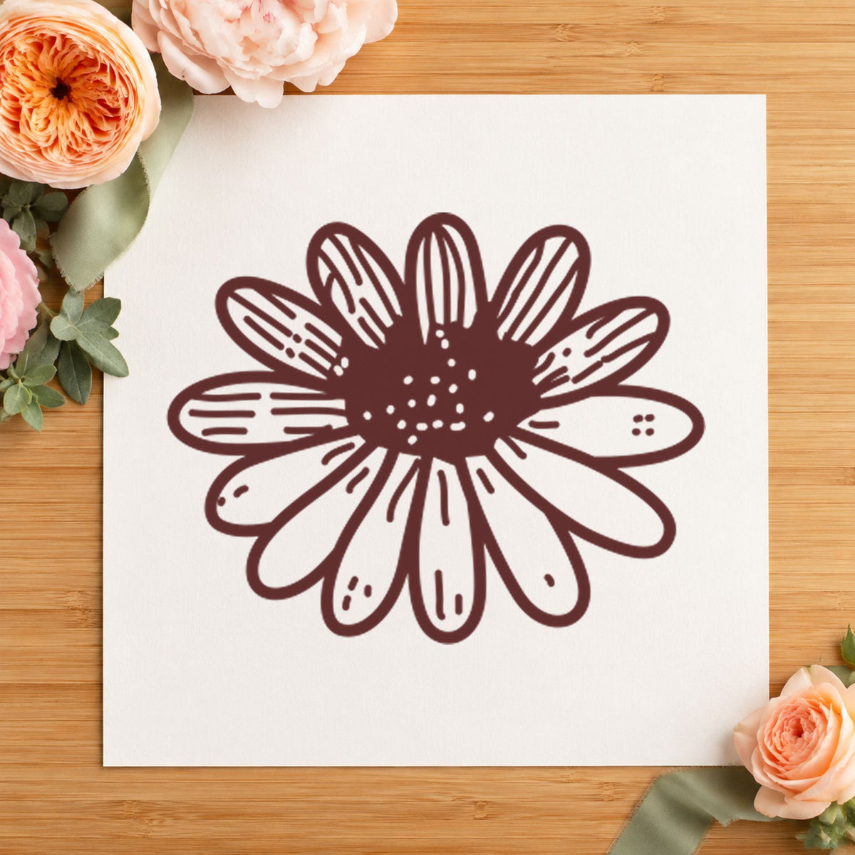 Daisy Flower Rubber Stamp Small impression in brown ink on white paper in a styled craft setting.