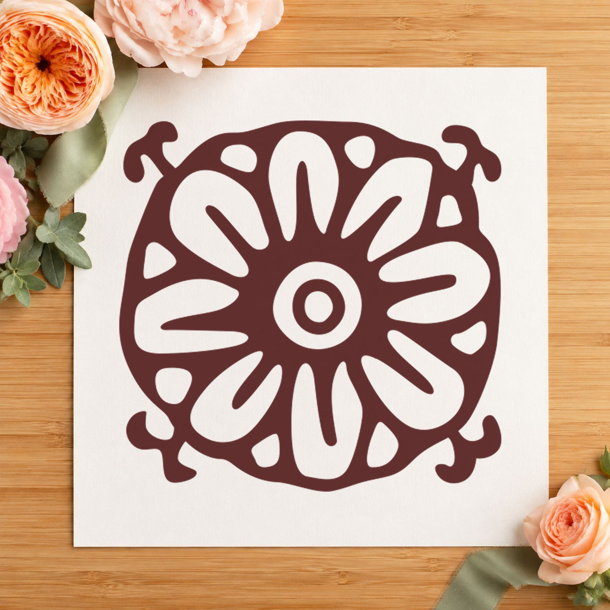Square Flower Motif Rubber Stamp impression in brown ink on white paper in a styled craft setting.