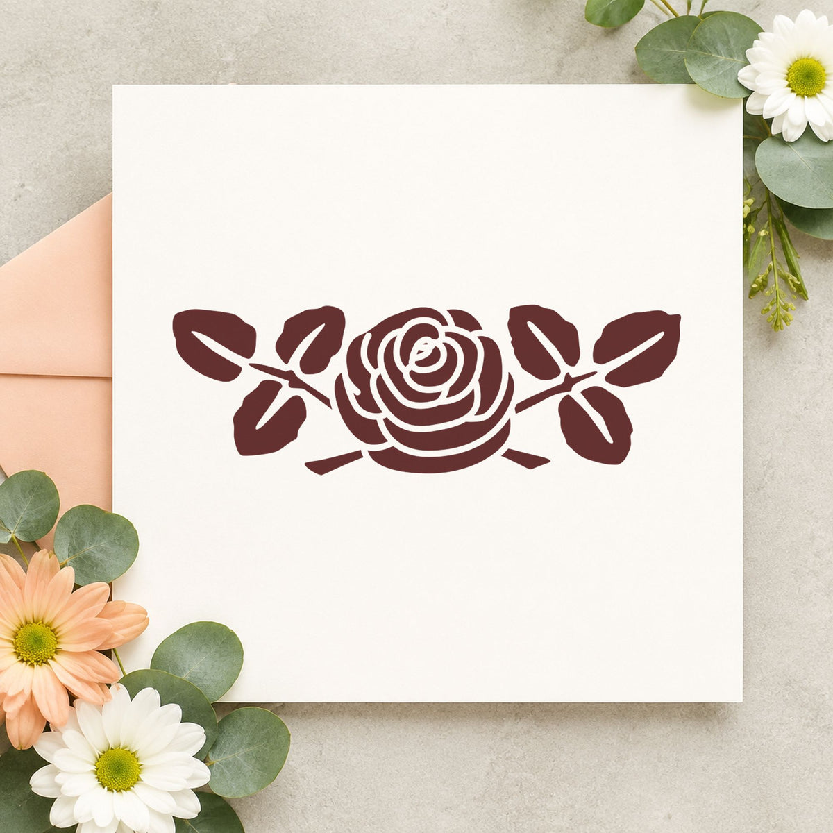 Rose Flower Rubber Stamp Large impression in brown ink on white paper in a styled craft setting.