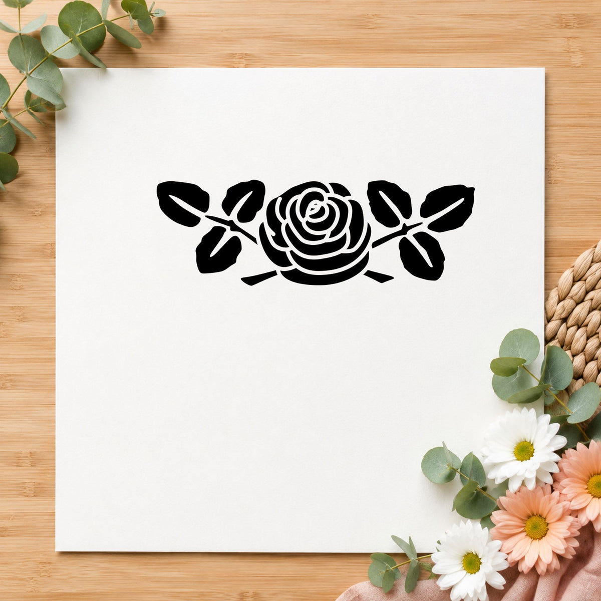 Rose with Leaves Rubber Stamp Small impression in black ink on white paper in a styled craft setting.