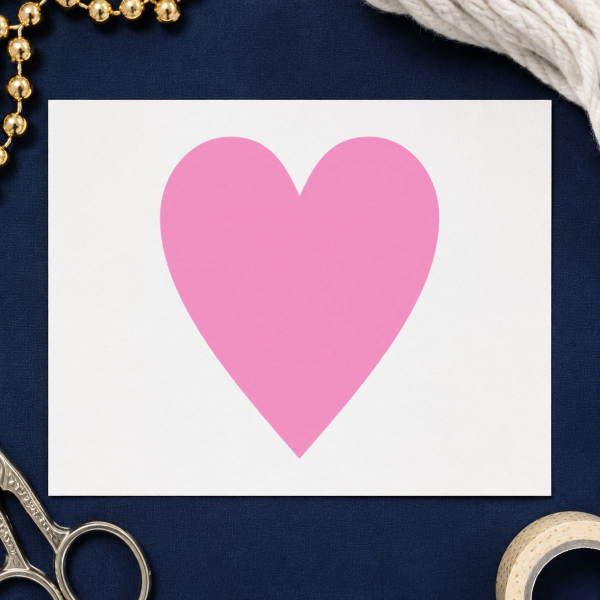 Playing Card Heart Rubber Stamp impression in pink ink on white paper in a styled craft setting.