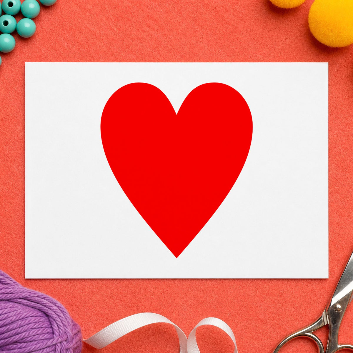 Playing Card Heart Rubber Stamp impression in red ink on white paper in a styled craft setting.