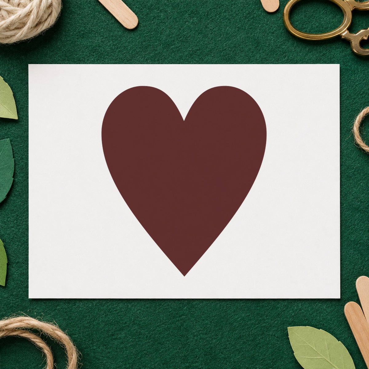 Playing Card Heart Rubber Stamp impression in brown ink on white paper in a styled craft setting.