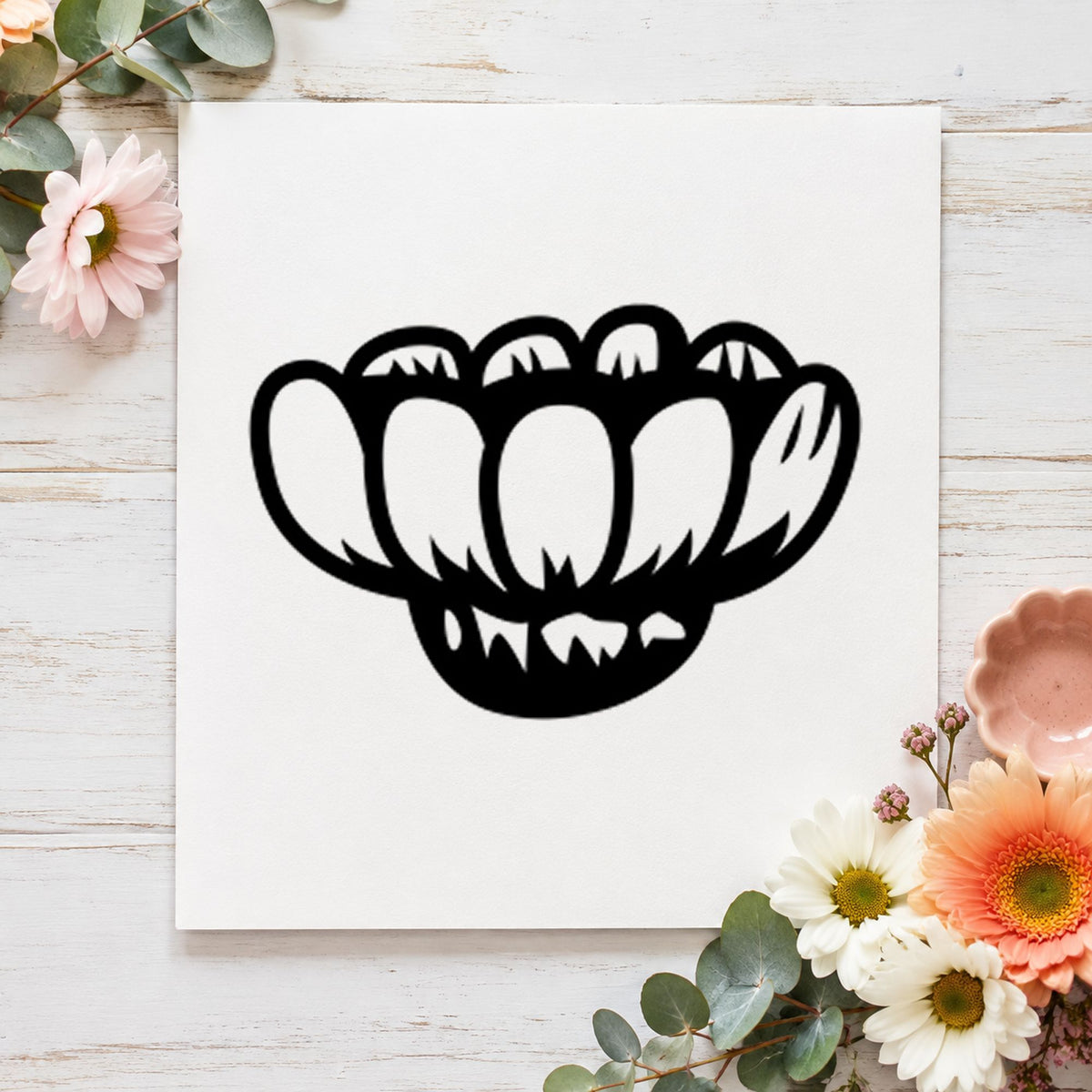 Sideways Daisy Rubber Stamp impression in black ink on white paper in a styled craft setting.