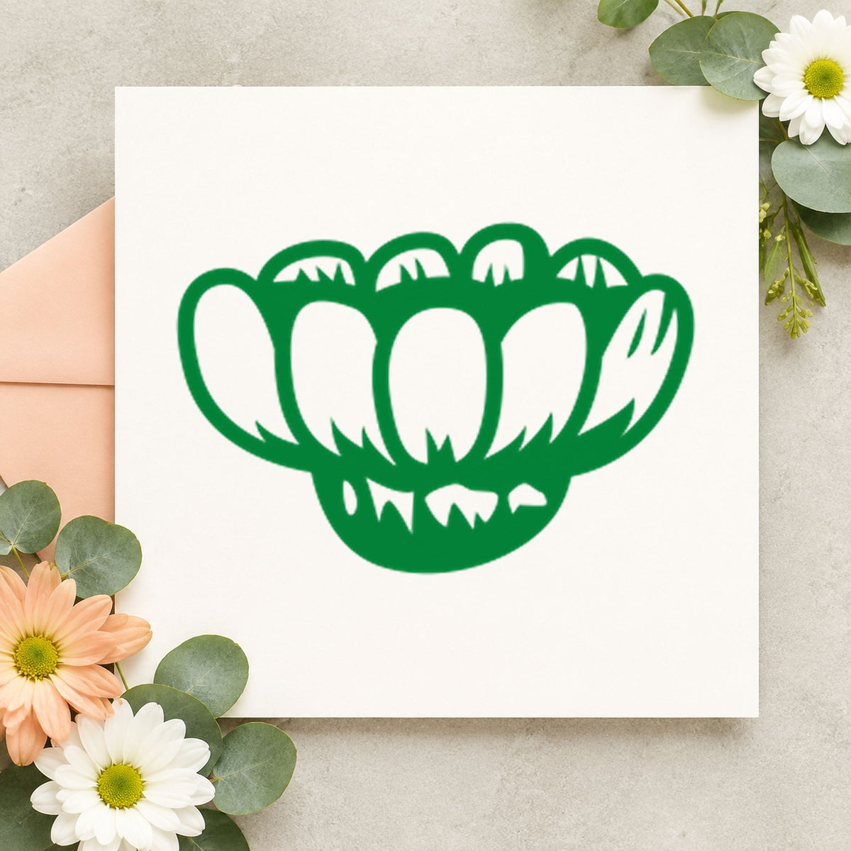 Sideways Daisy Rubber Stamp impression in green ink on white paper in a styled craft setting.