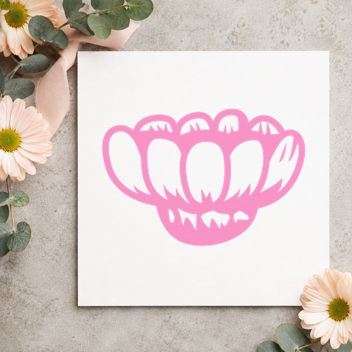 Sideways Daisy Rubber Stamp impression in pink ink on white paper in a styled craft setting.