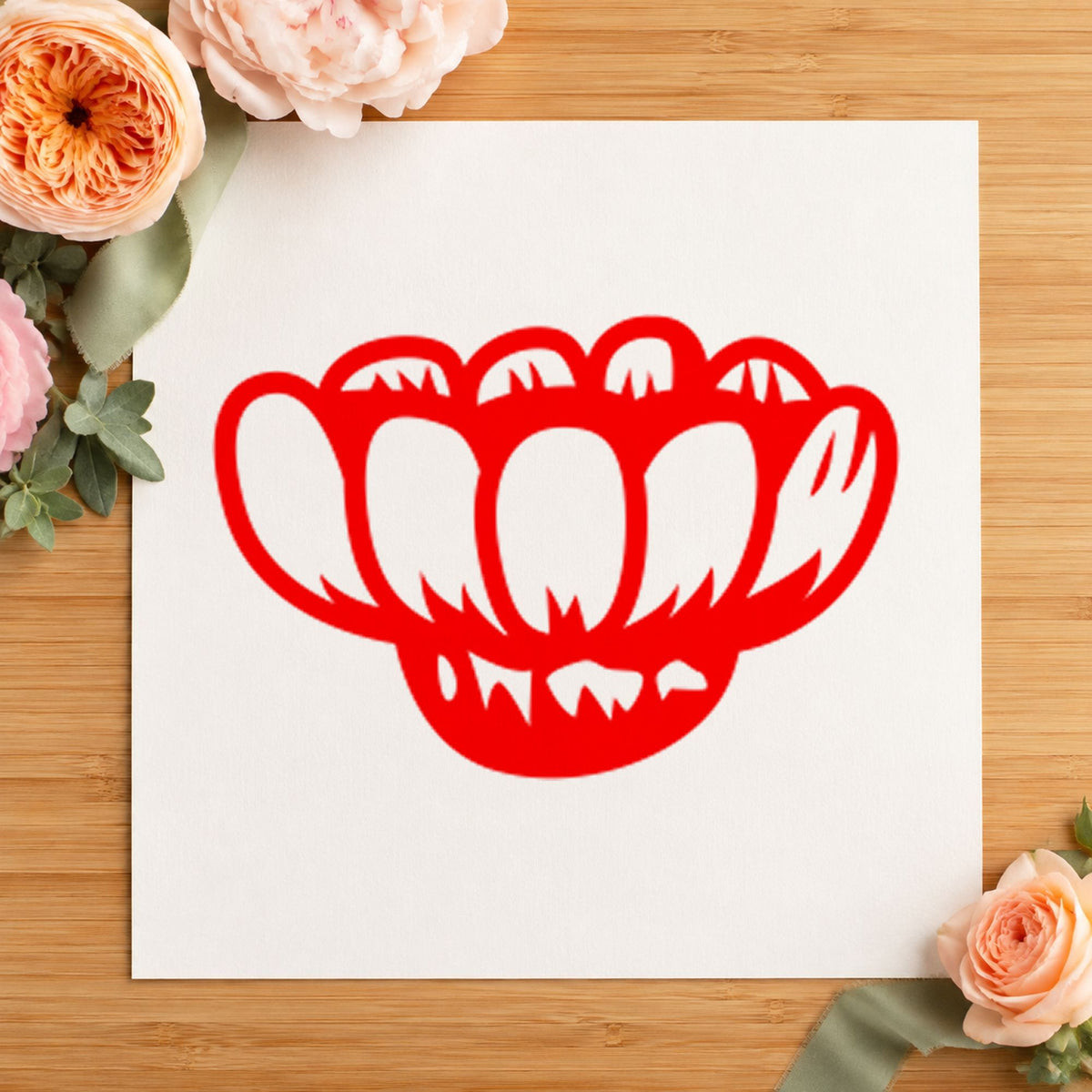 Sideways Daisy Rubber Stamp impression in red ink on white paper in a styled craft setting.