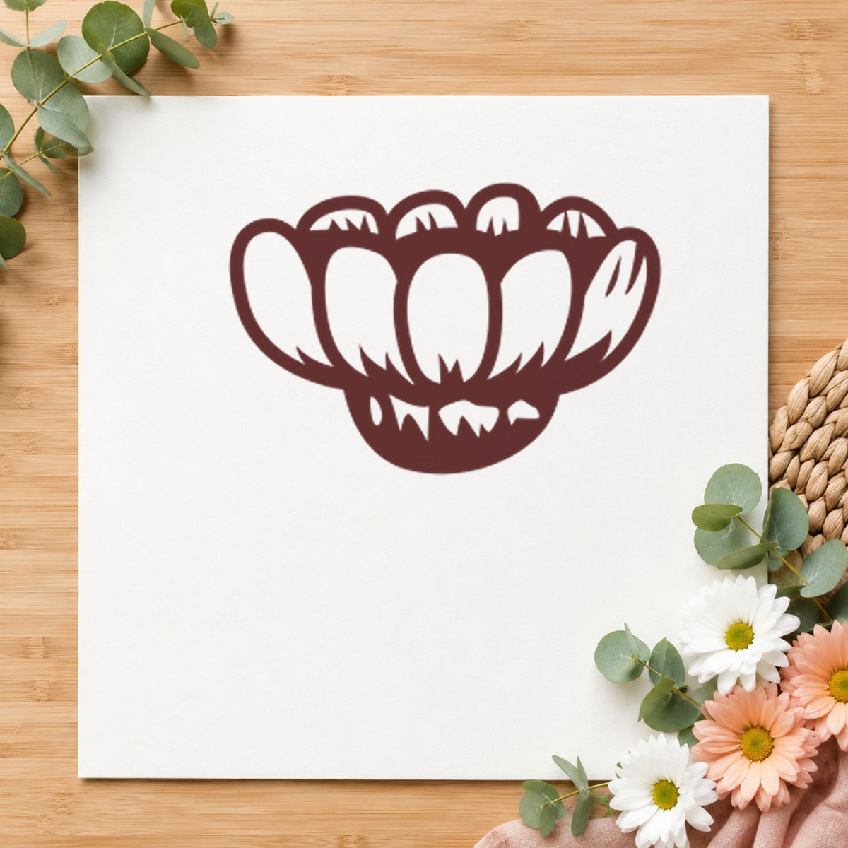 Sideways Daisy Rubber Stamp impression in brown ink on white paper in a styled craft setting.