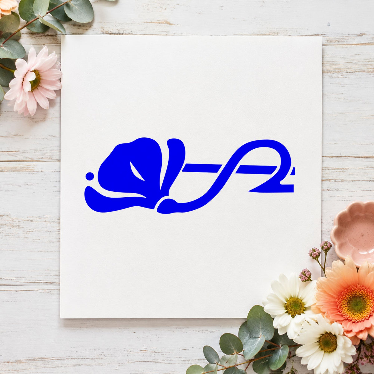 Left Flower Border Rubber Stamp impression in blue ink on white paper in a styled craft setting.