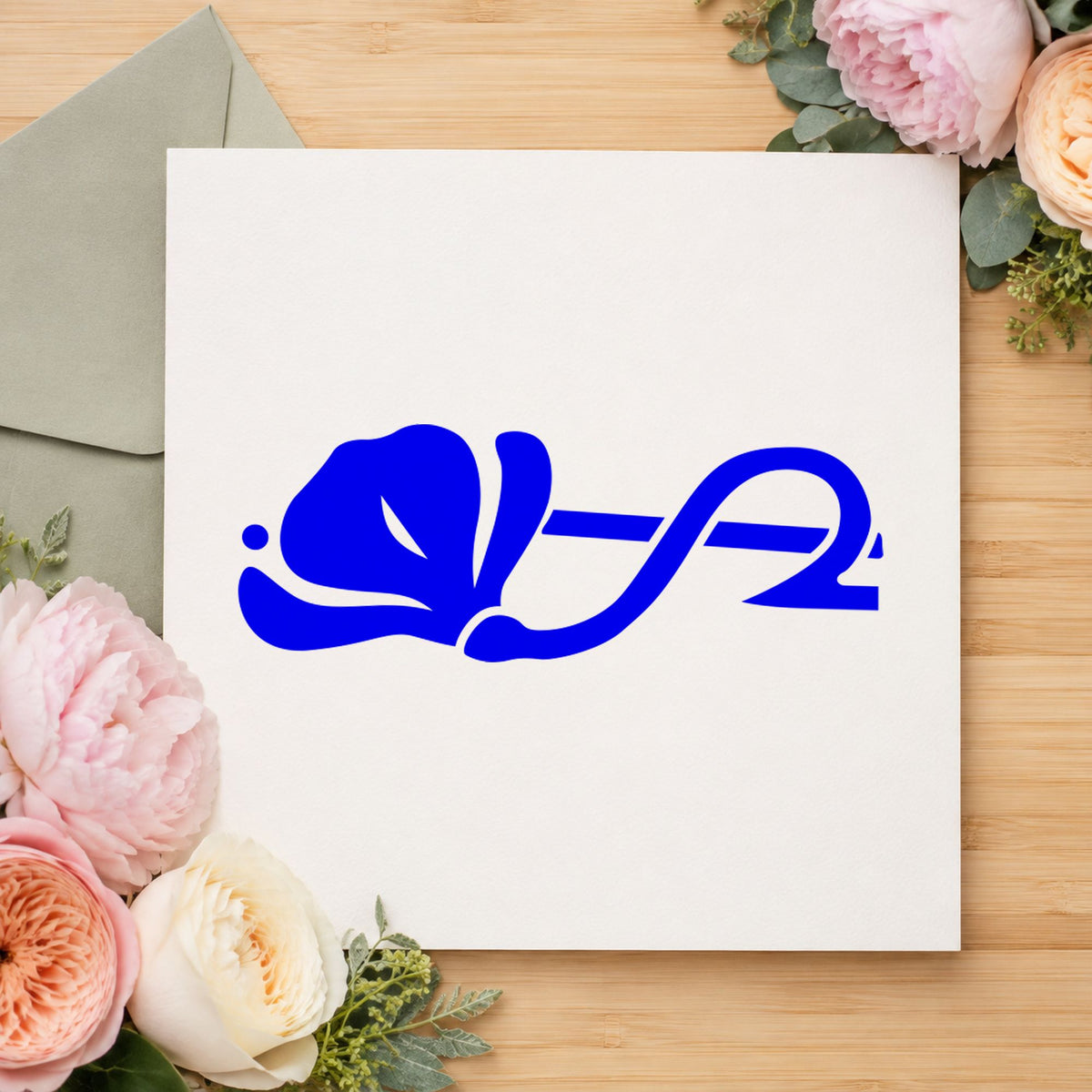 Blue botanical craft stamp impression featuring the left flower border design on white paper.