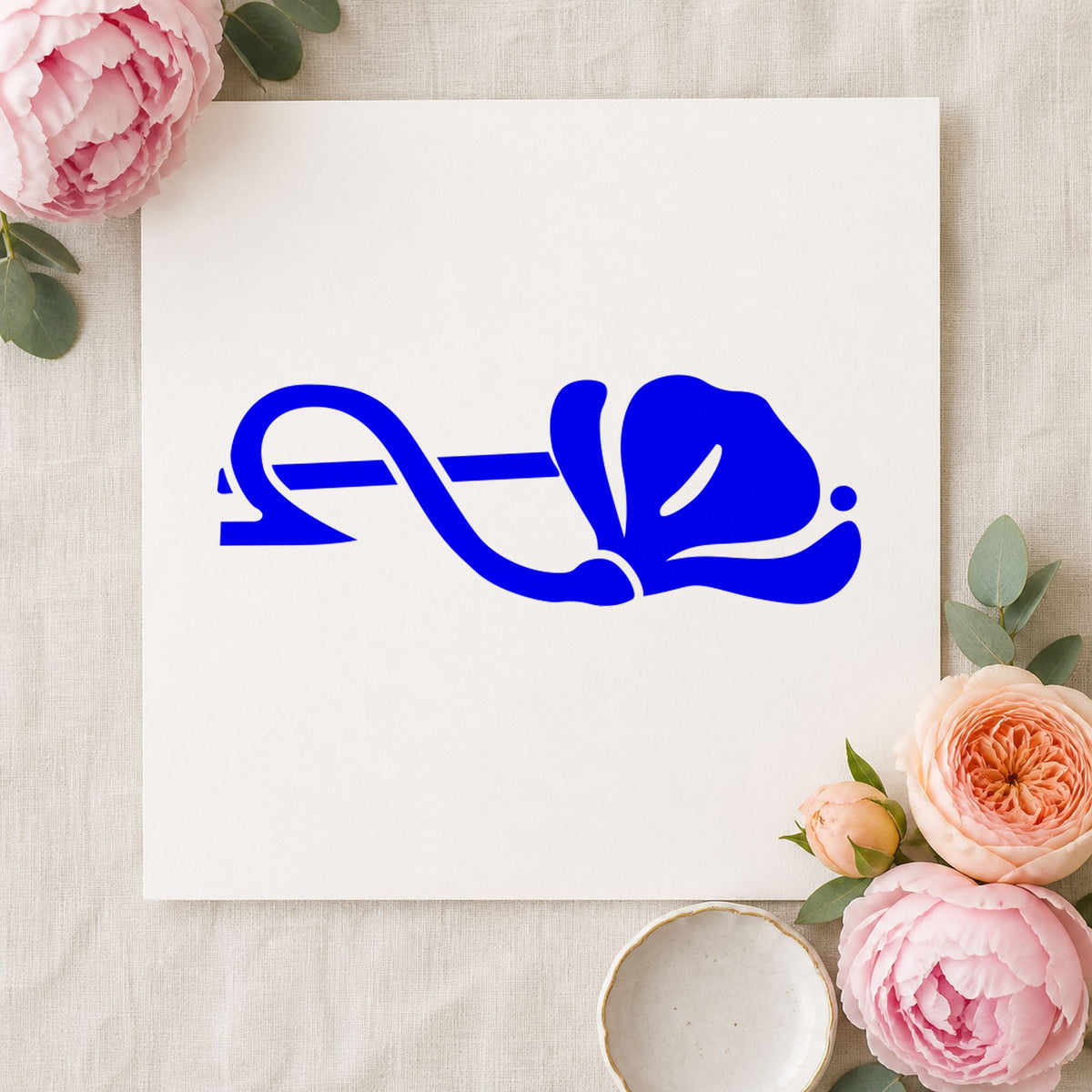 Right Single Flower Border Rubber Stamp impression in blue ink on white paper in a styled craft setting.