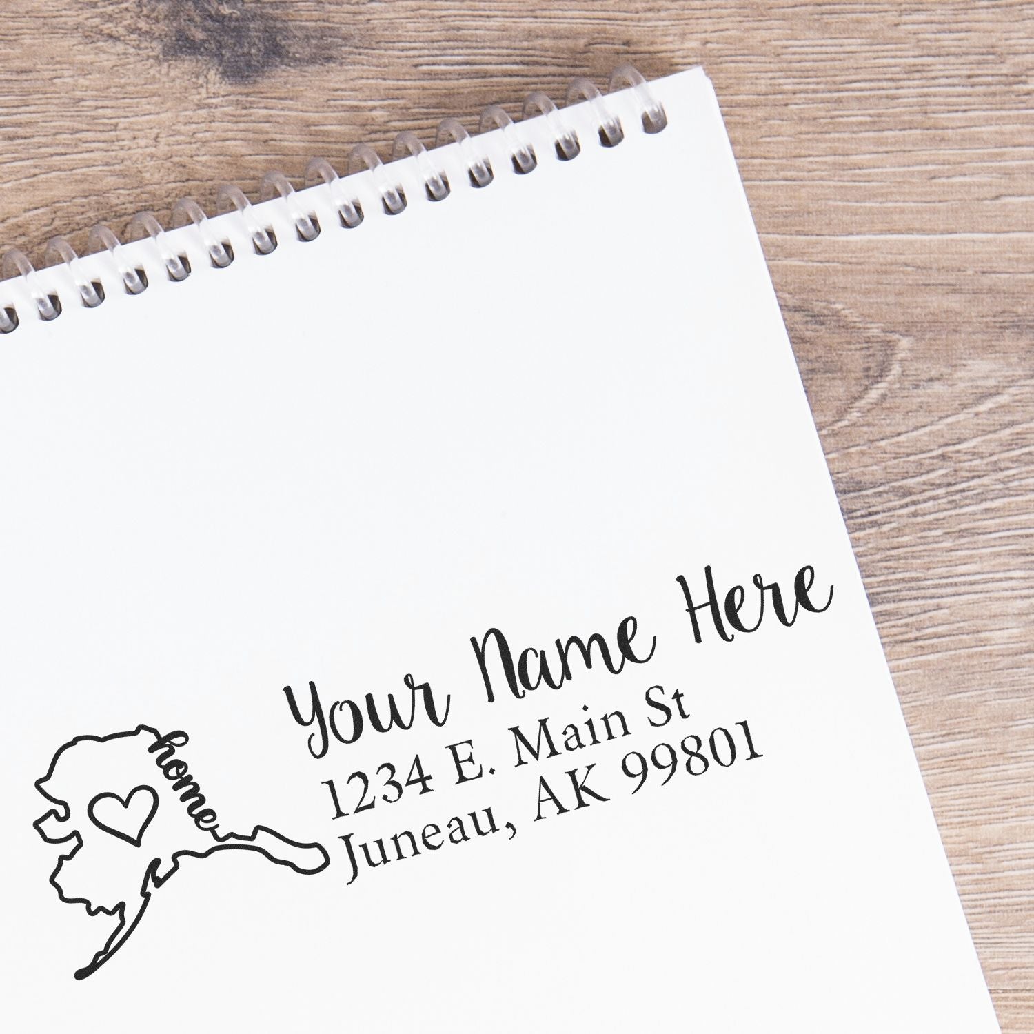 Custom Alaska return address rubber stamp with name and mailing address for personalized envelopes and stationery.