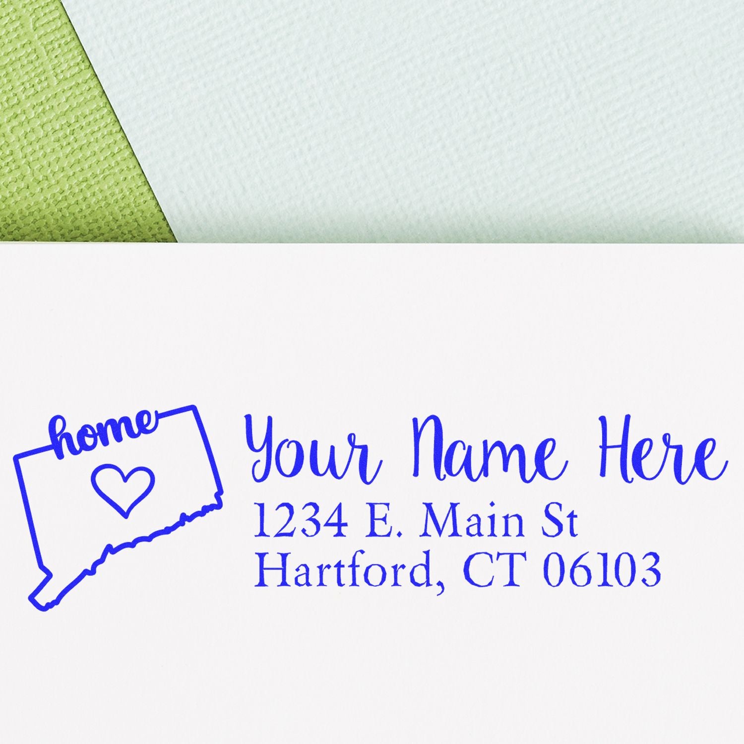 Personalized return address rubber stamp with Connecticut home design, heart icon, name, and mailing address in blue ink.