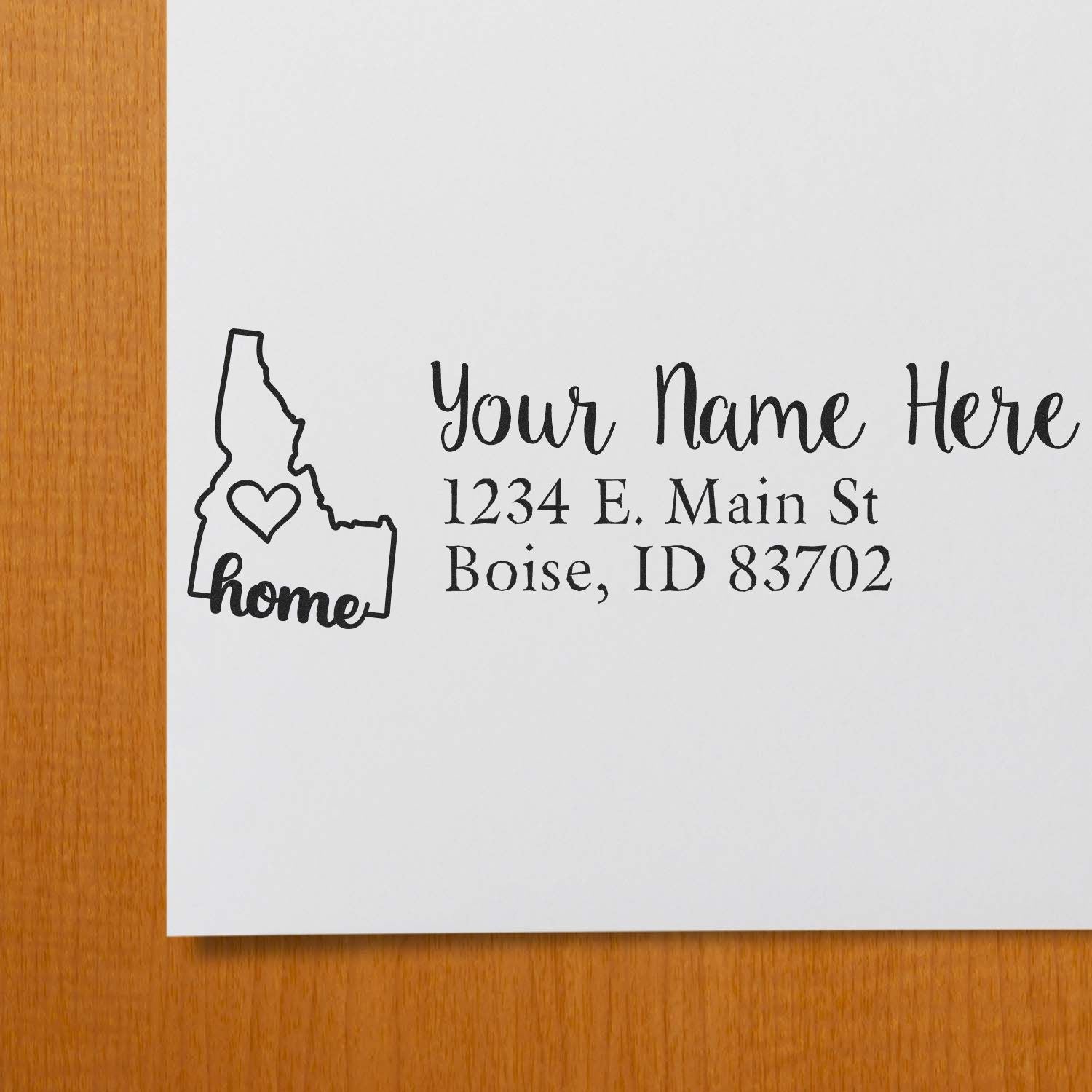Custom return address rubber stamp with Idaho home icon and personalized Boise, ID address.