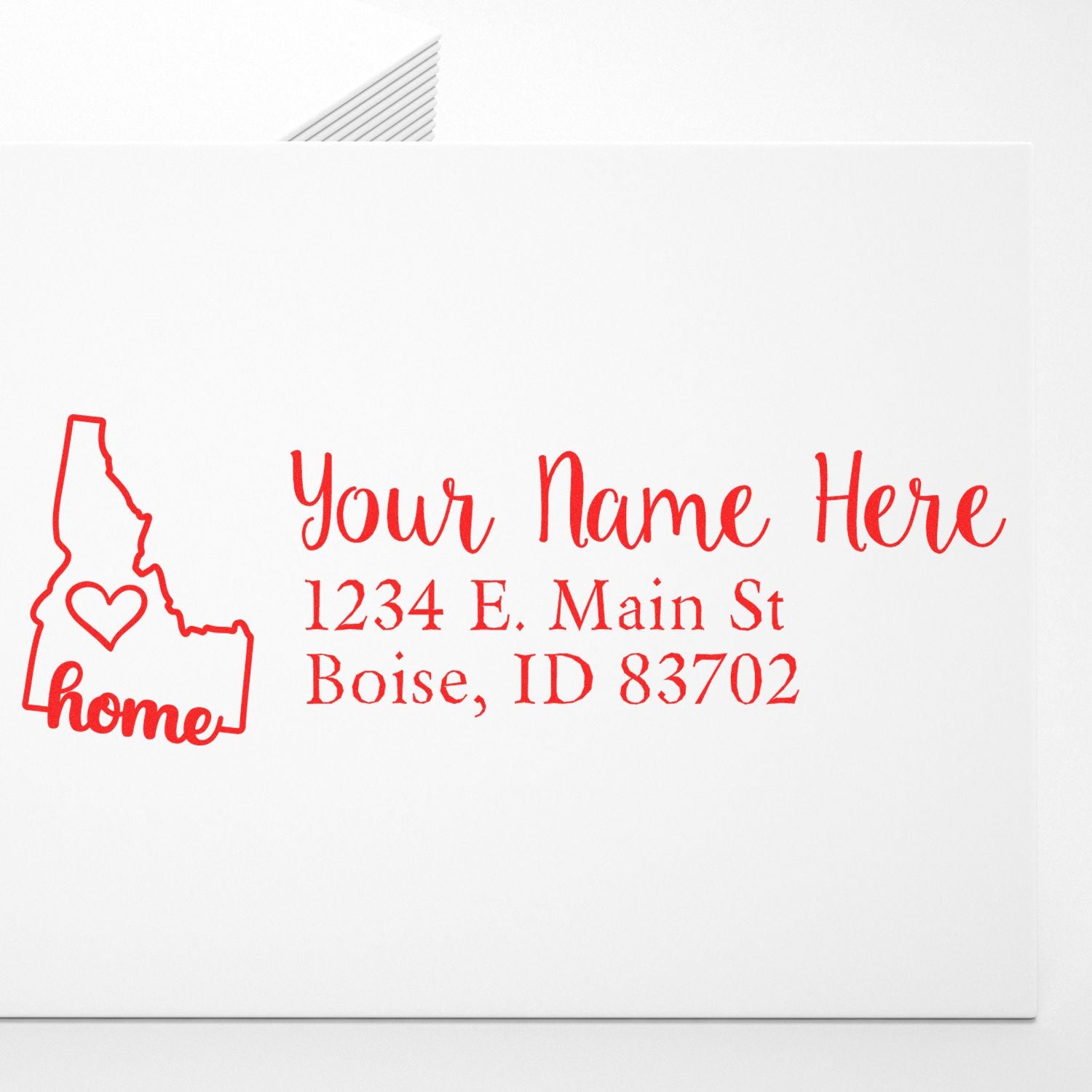 Personalized return address rubber stamp with Idaho home icon and Boise, ID address.