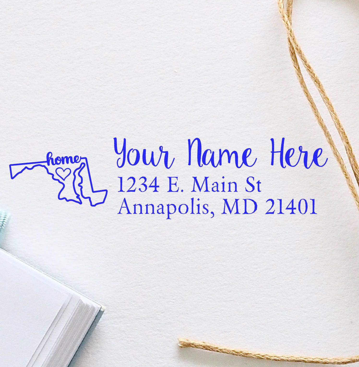 Custom rubber return address stamp with Maryland home outline, personalized name, and Annapolis, MD address.