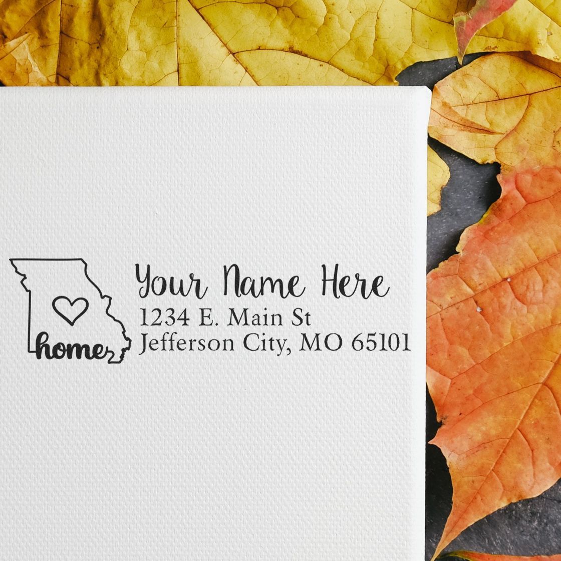 Personalized Missouri home return address rubber stamp with heart icon, name, and address sample.