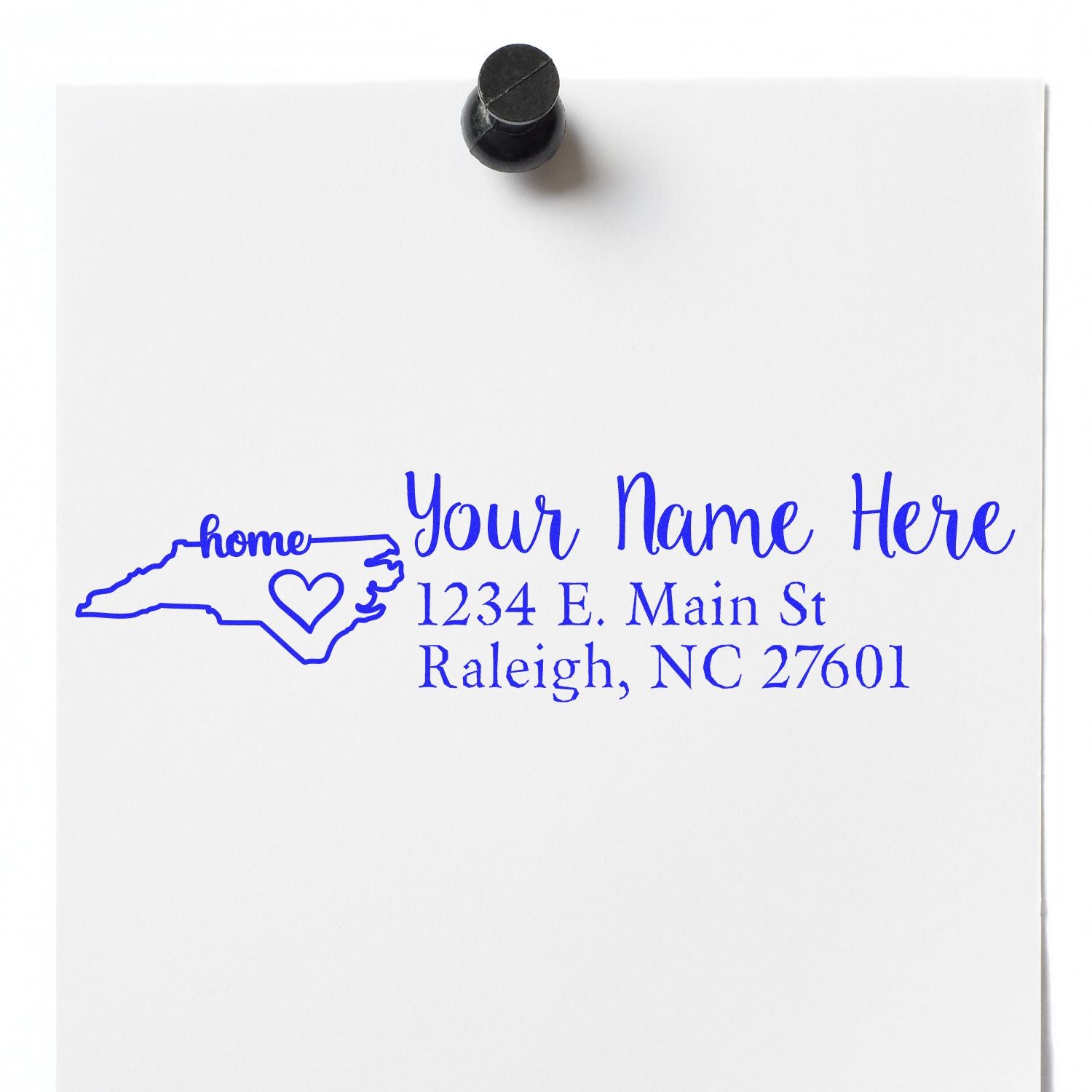 Custom North Carolina return address rubber stamp with name, street address, and Raleigh, NC 27601.