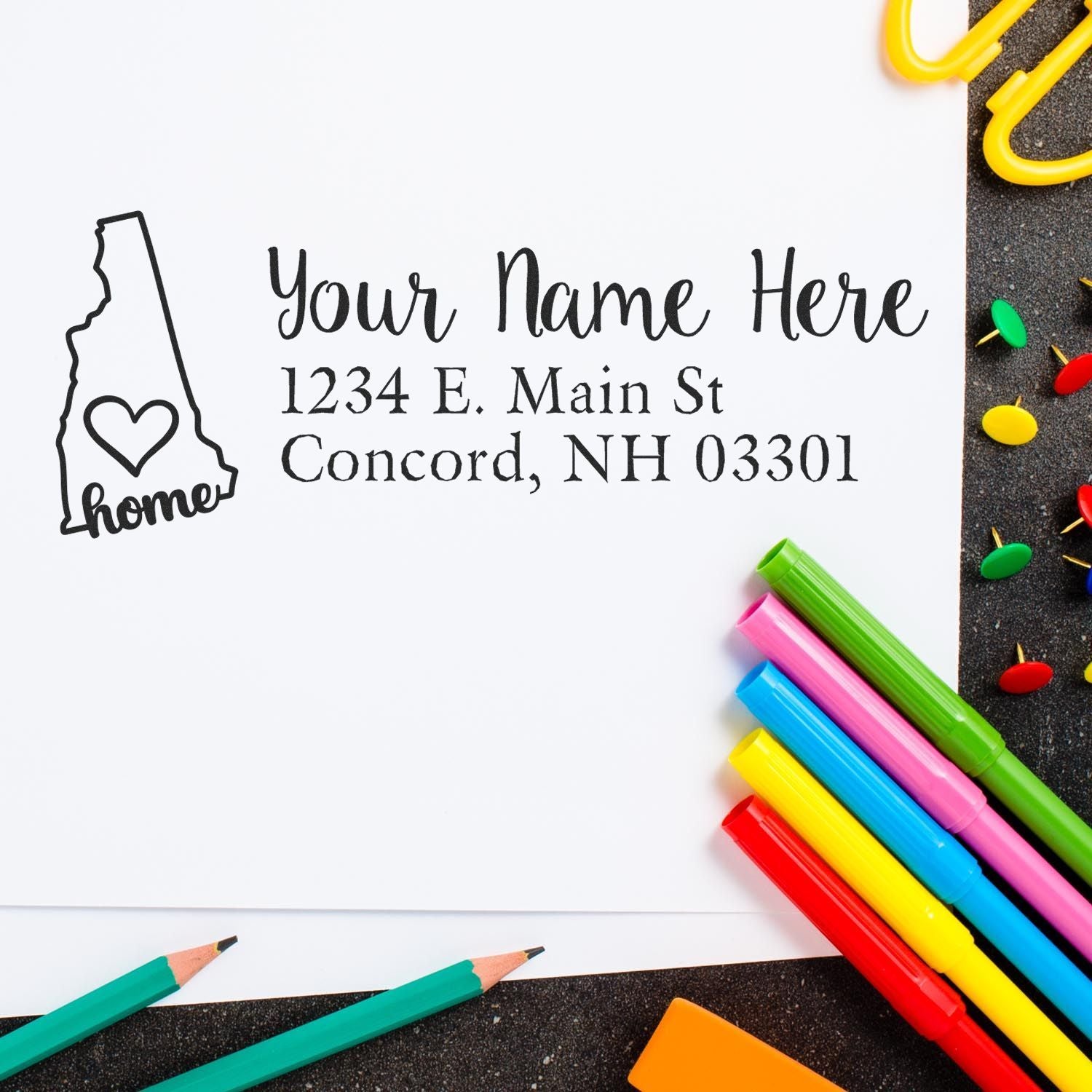 Custom return address rubber stamp with New Hampshire home icon, name placeholder, and mailing address design.