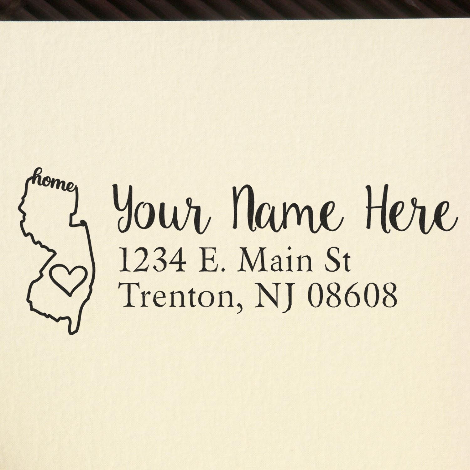 Custom New Jersey address rubber stamp with home icon and personalized return address for envelopes.