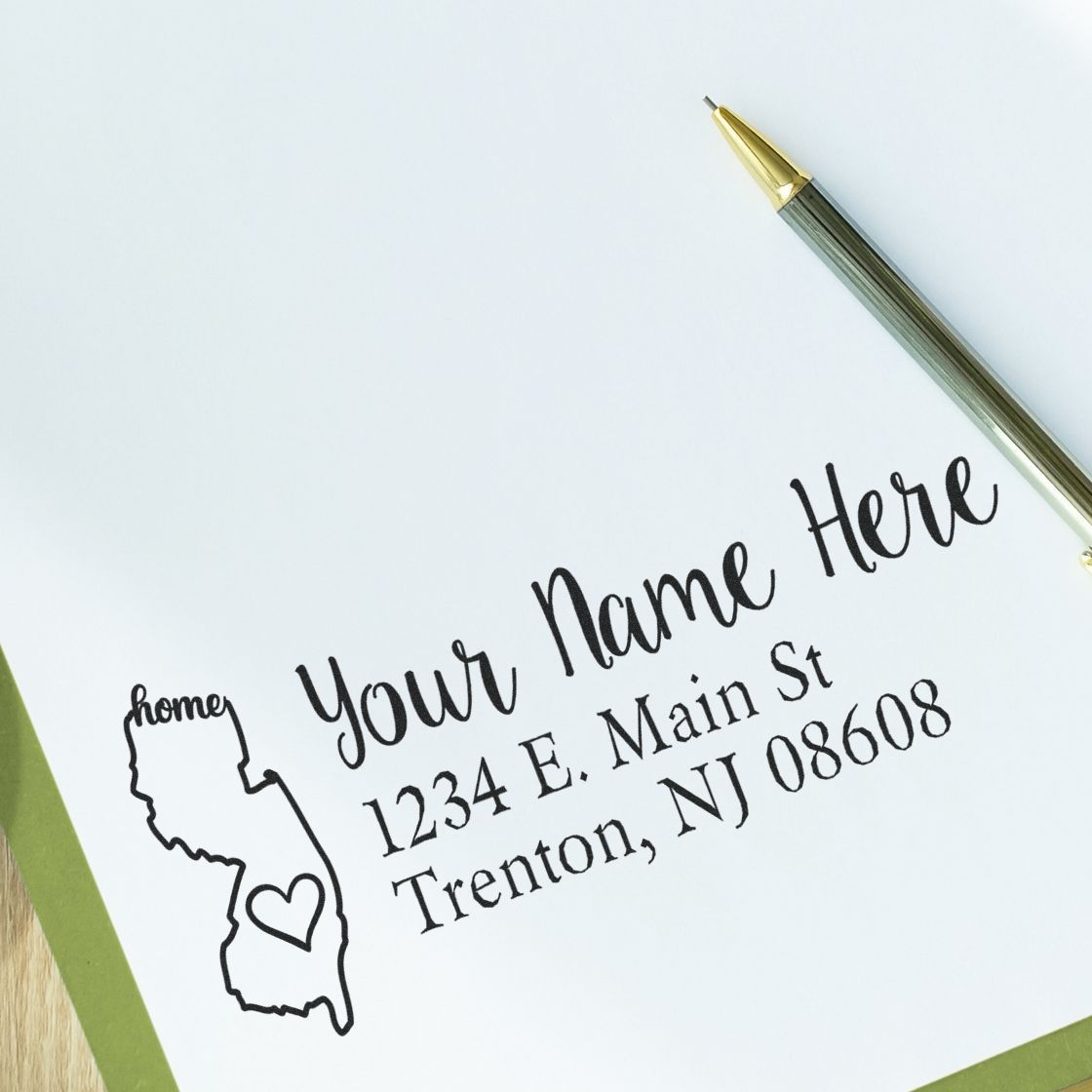 Custom return address rubber stamp with New Jersey state outline, perfect for personalized mailings and stationery.