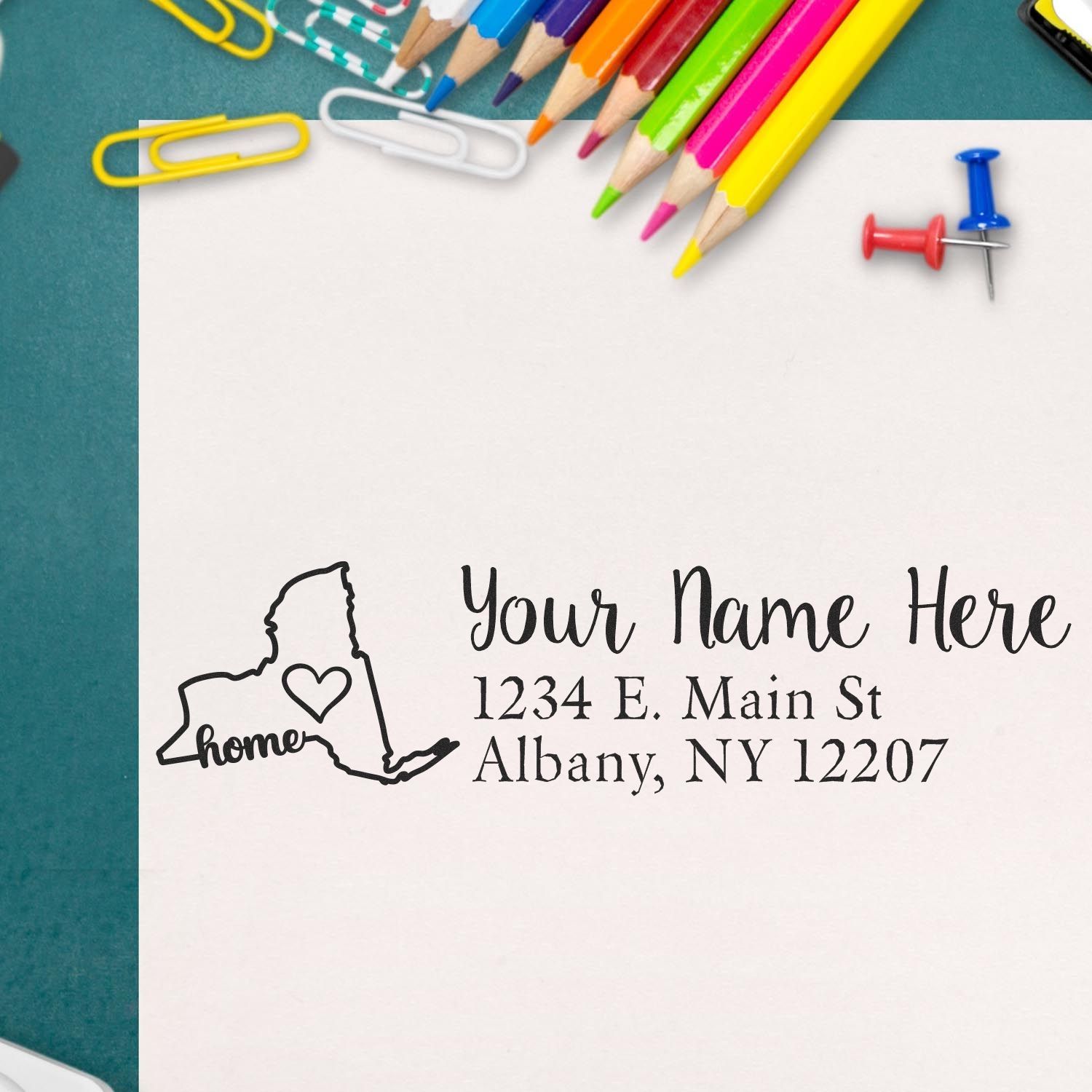 Custom return address rubber stamp with New York home design, personalized name, street, city, and ZIP on stationery.