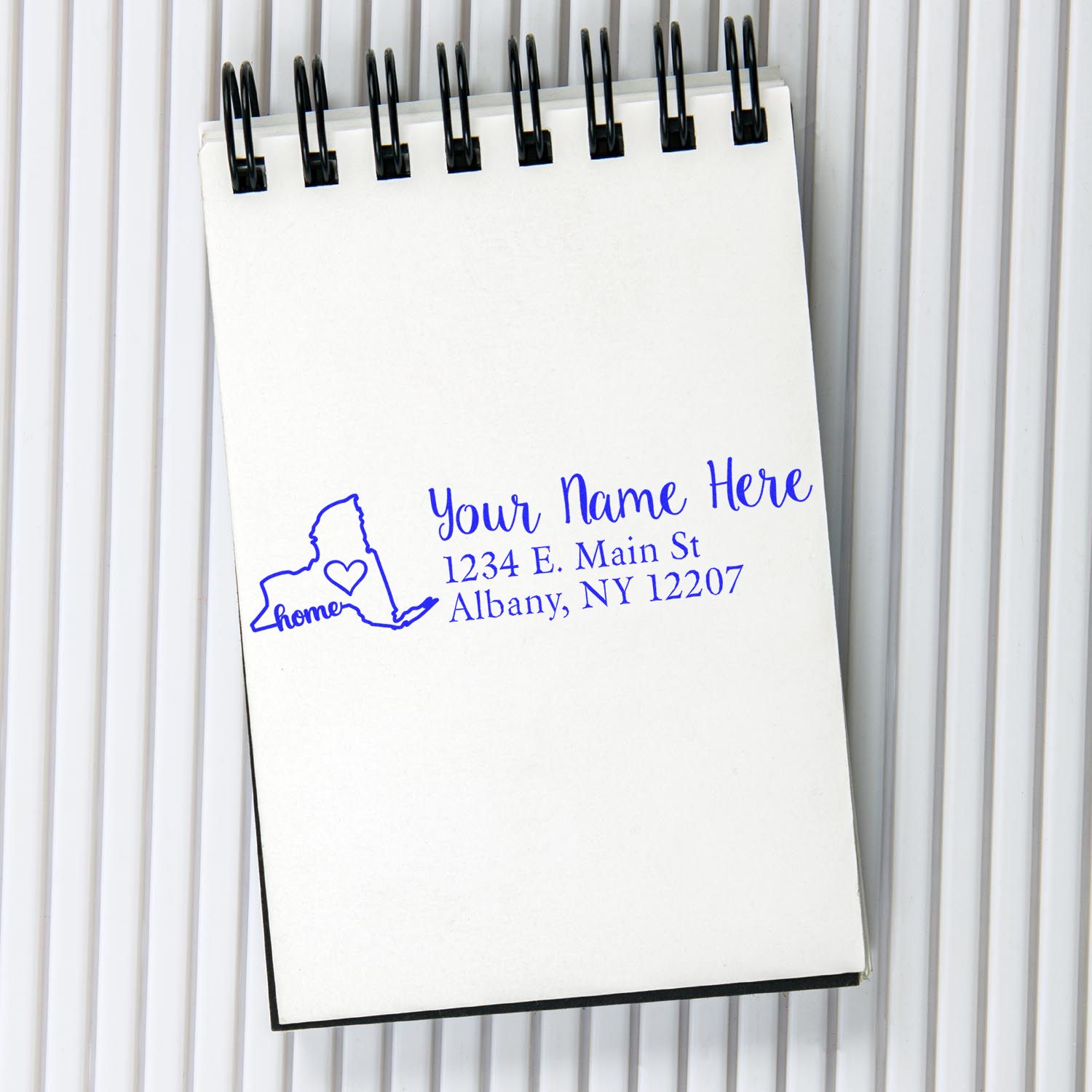 Personalized return address rubber stamp with New York home design, name, and mailing address.