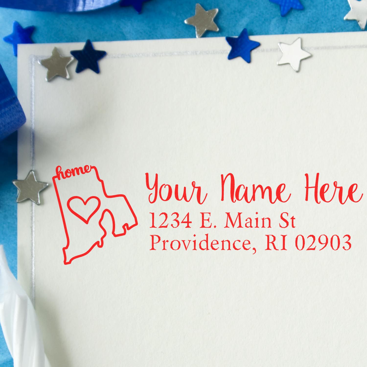 Custom rubber stamp return address with Rhode Island home outline, personalized mailing stamp on blank envelope.
