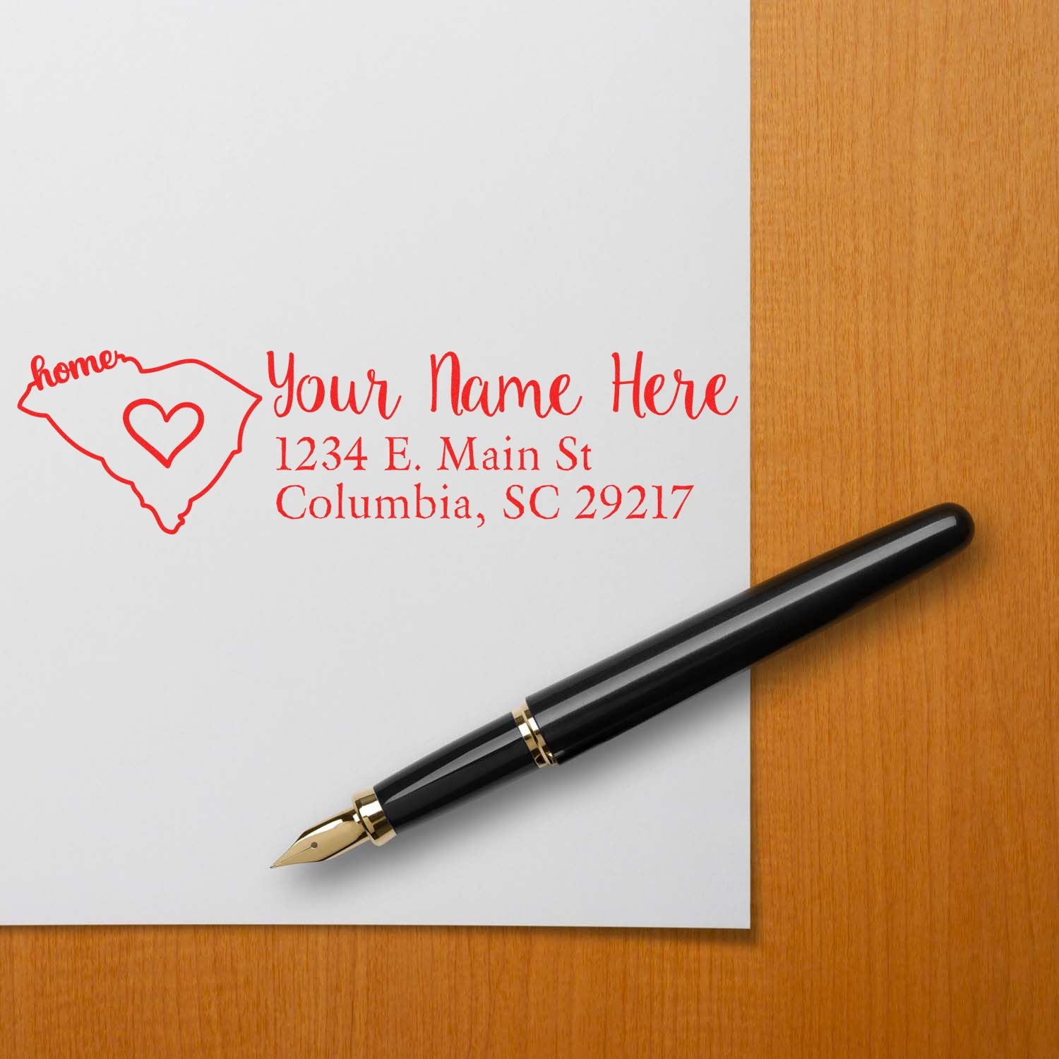 Custom South Carolina return address rubber stamp with personalized name and address in red ink on paper.