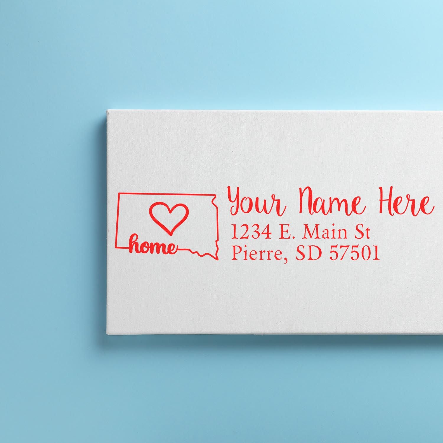 Custom address rubber stamp with South Dakota home design, heart icon, and personalized return address for mailing labels.