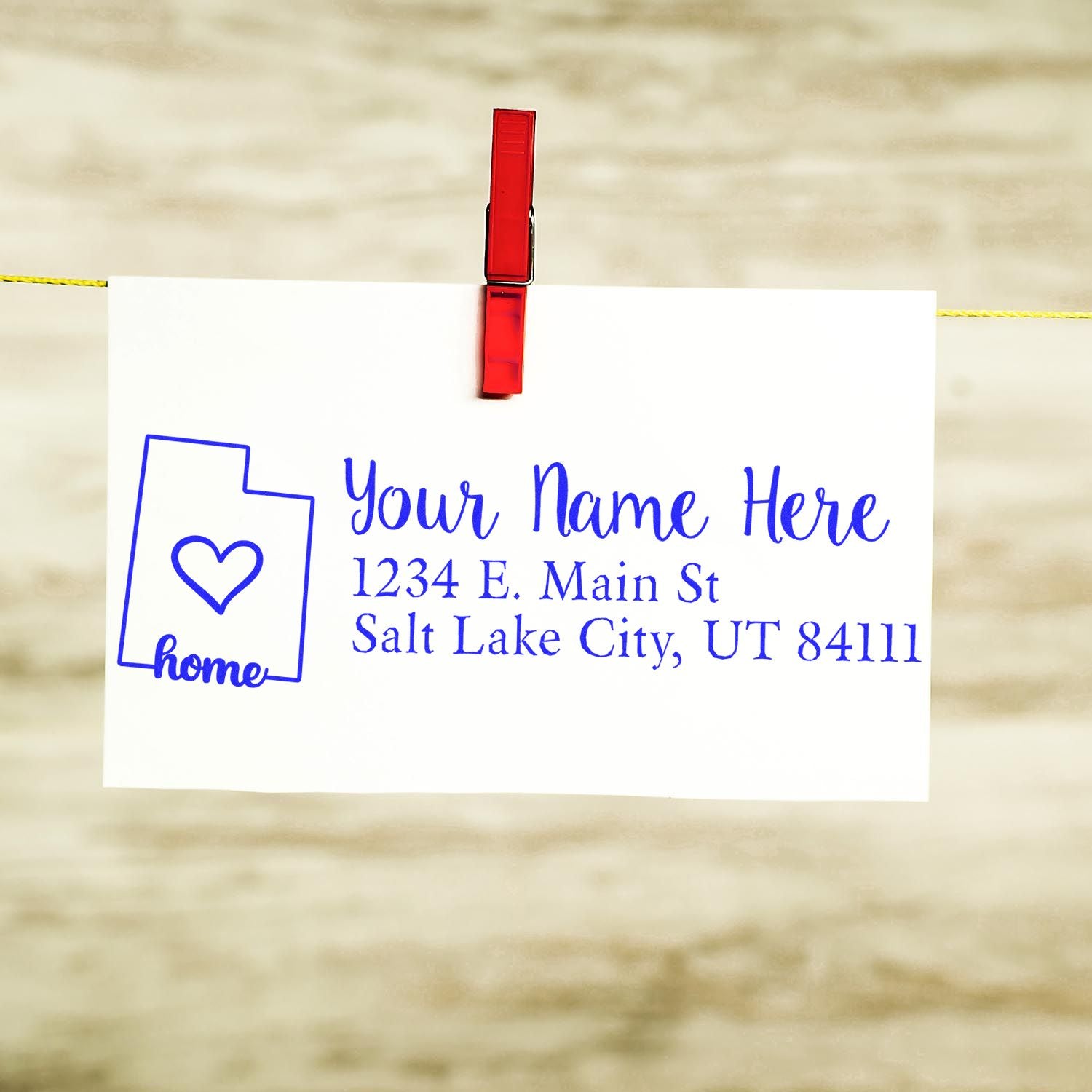Custom return address rubber stamp with home and heart design, personalized name and Salt Lake City, UT address.