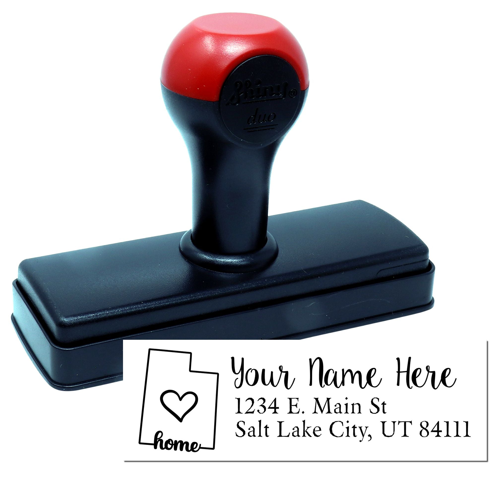 Custom self-inking address rubber stamp with personalized home name and return address design.