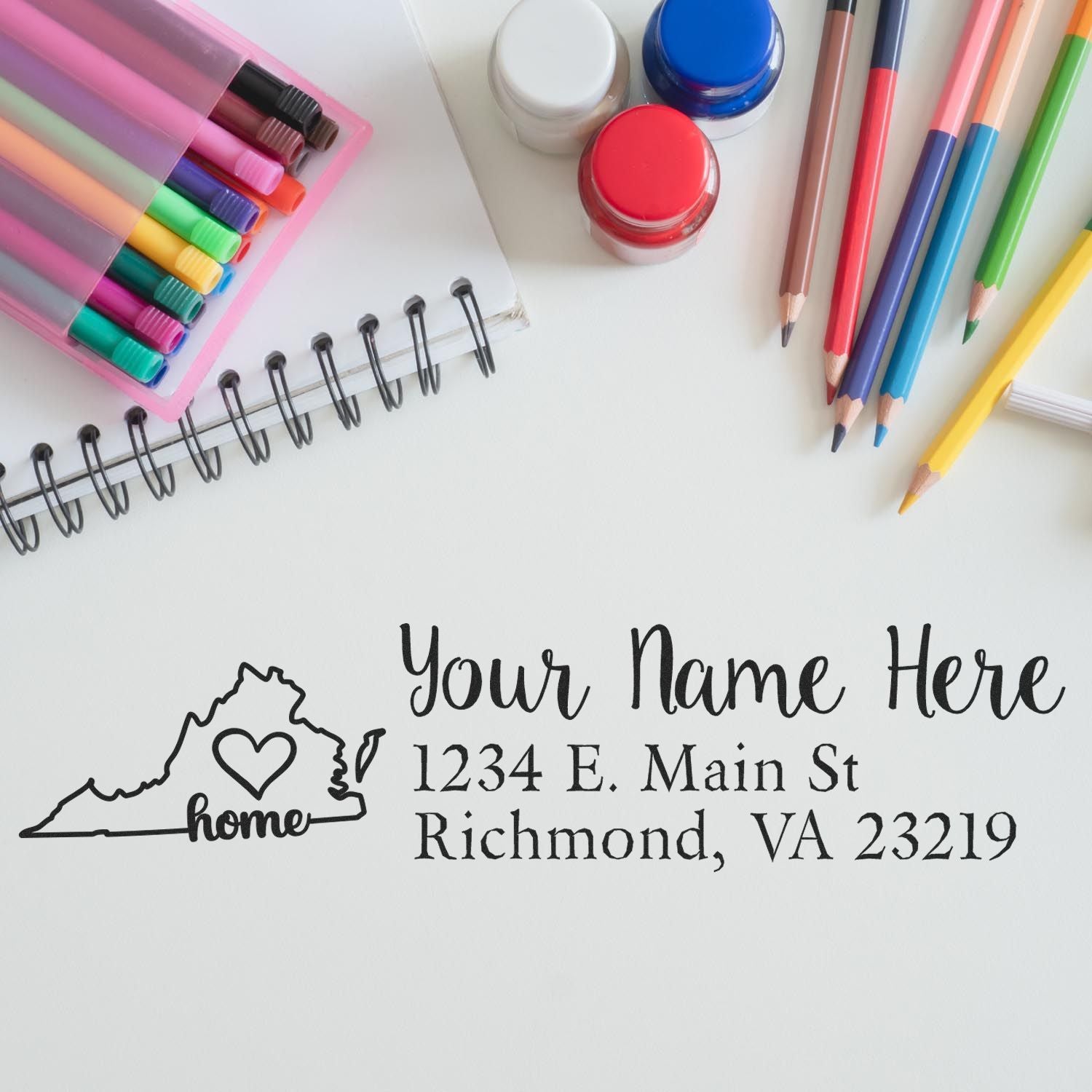 Personalized rubber address stamp proof with Virginia home icon, custom name, and mailing address for stationery.