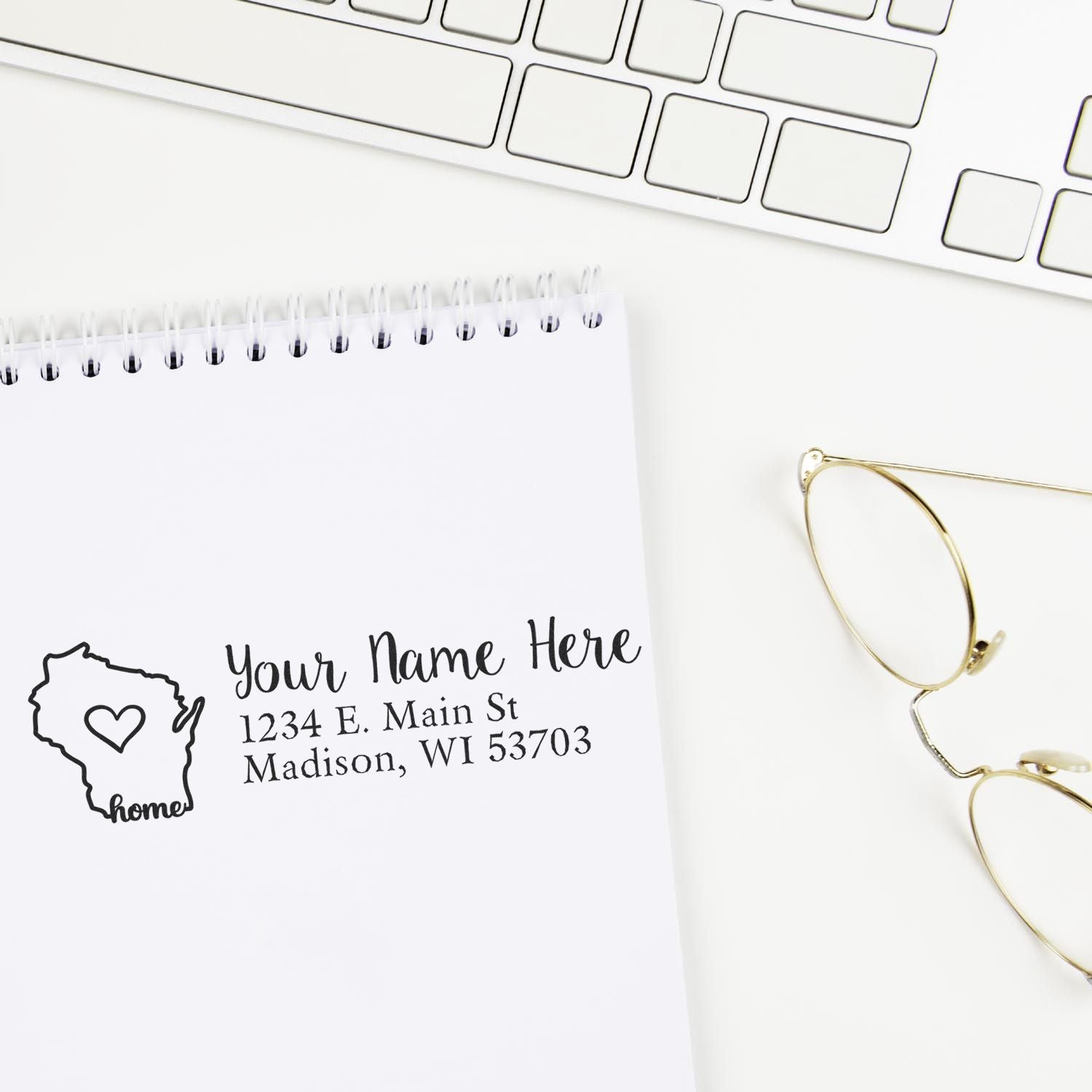 Personalized return address rubber stamp with Wisconsin home design on notebook, ideal for custom envelope addressing