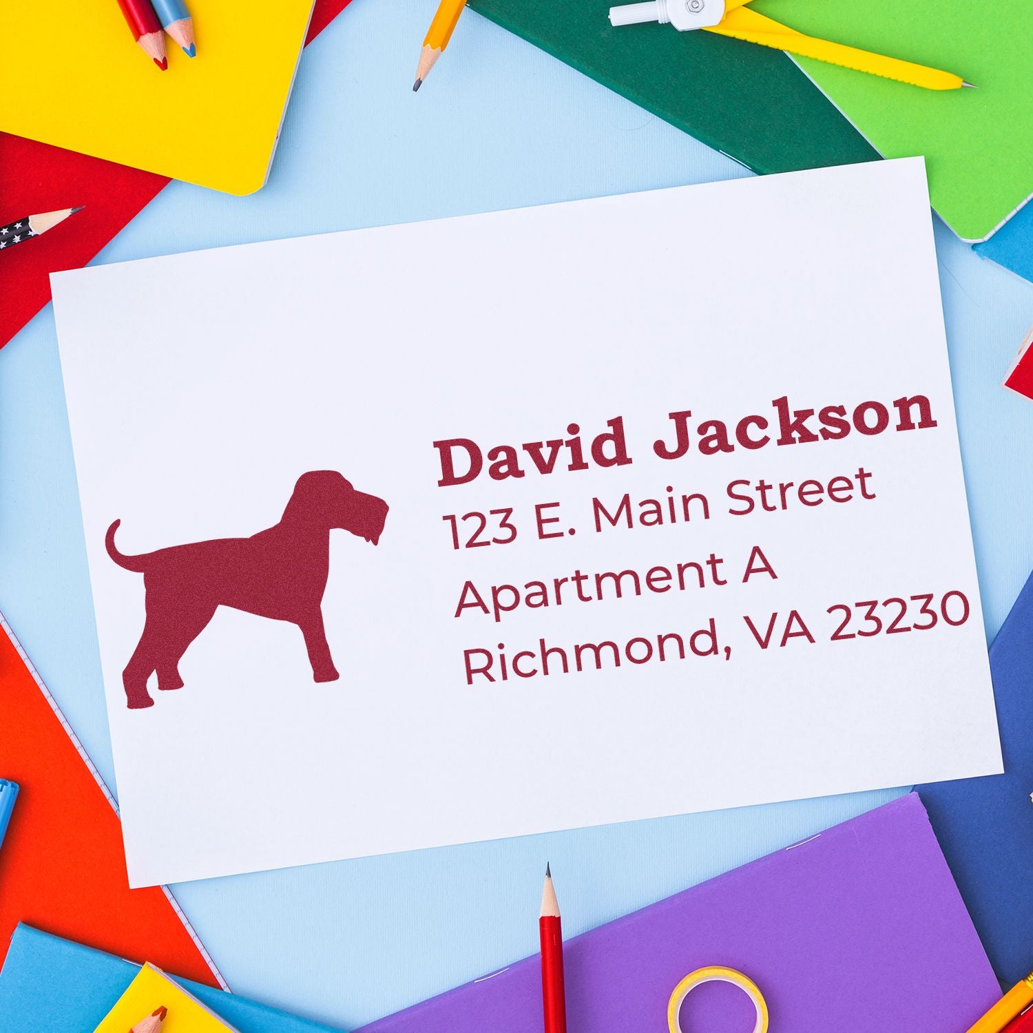 Custom return address rubber stamp with dog silhouette on envelope for personalized mailing labels.