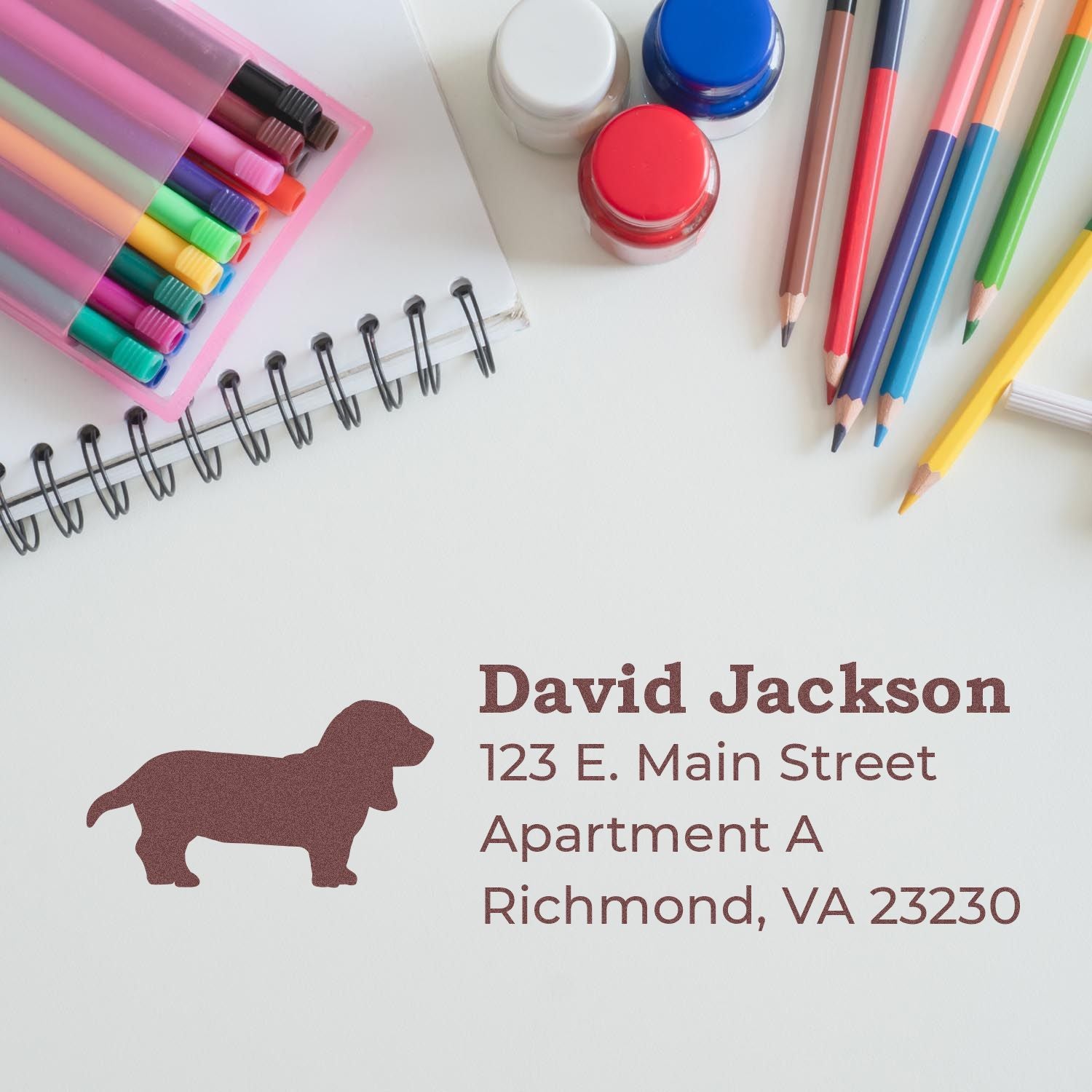 Custom dog silhouette rubber address stamp for personalized return address on envelopes and stationery.