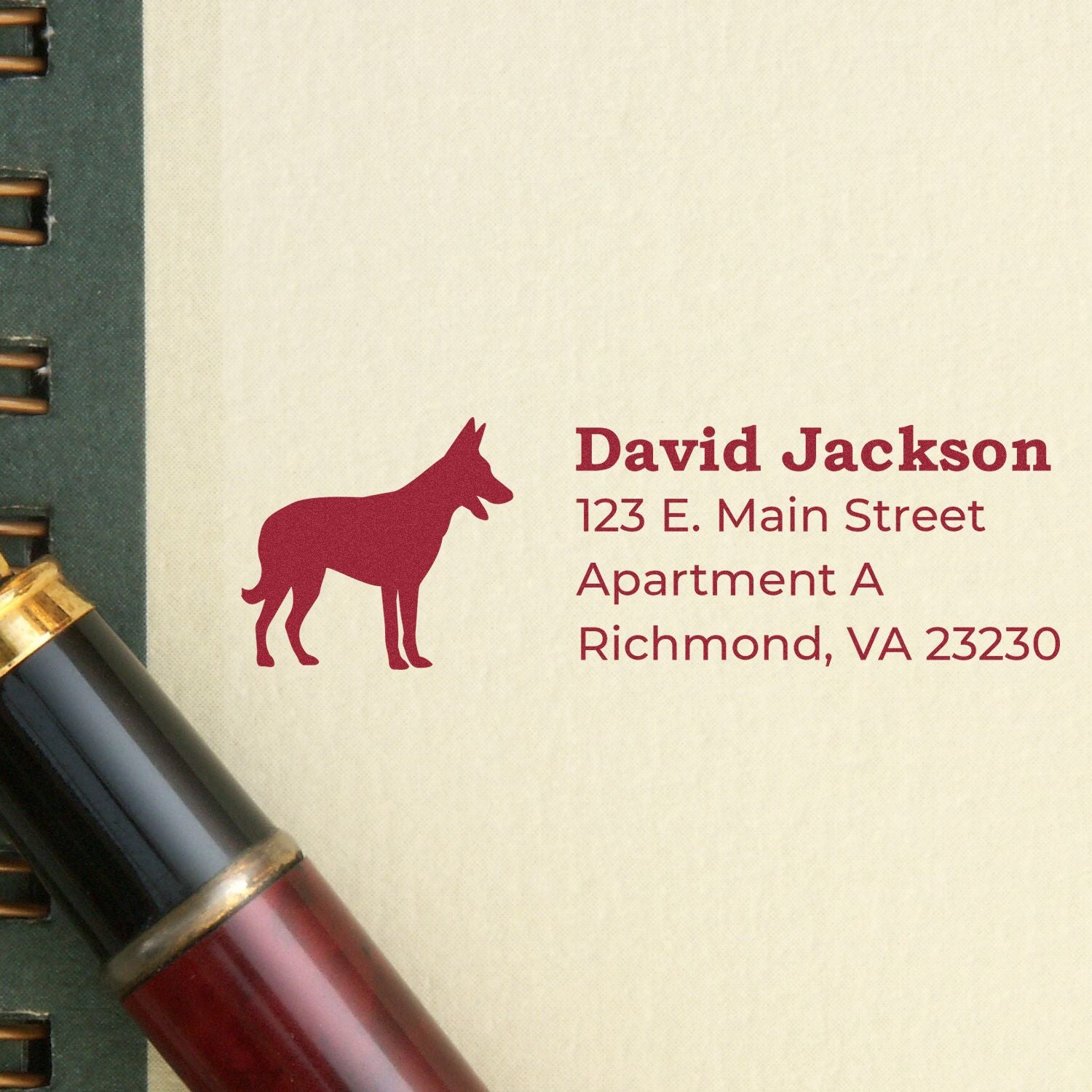 Custom address stamp with dog silhouette, featuring David Jackson return address in Richmond, VA for mailing envelopes.