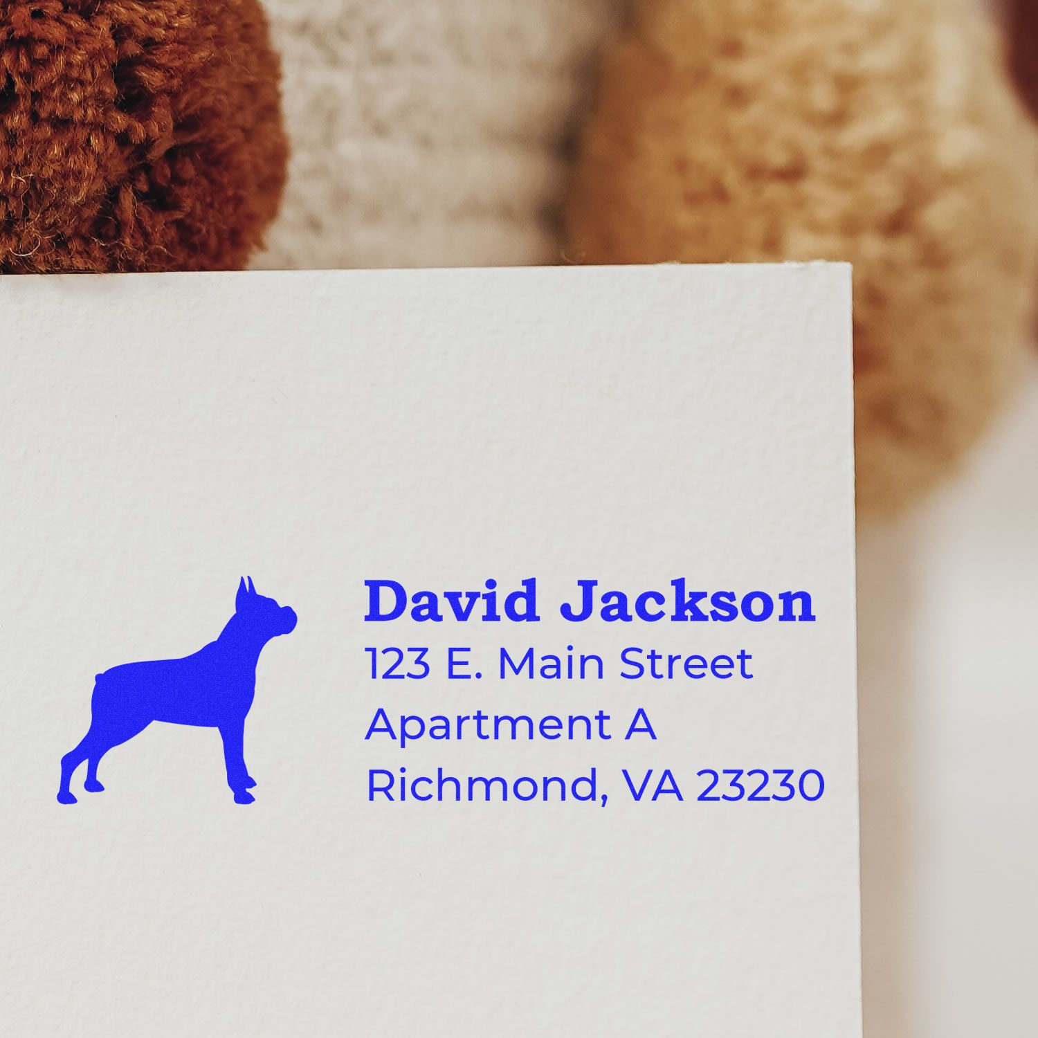 Custom rubber address stamp with dog silhouette for David Jackson, Richmond, VA apartment mailing envelopes.