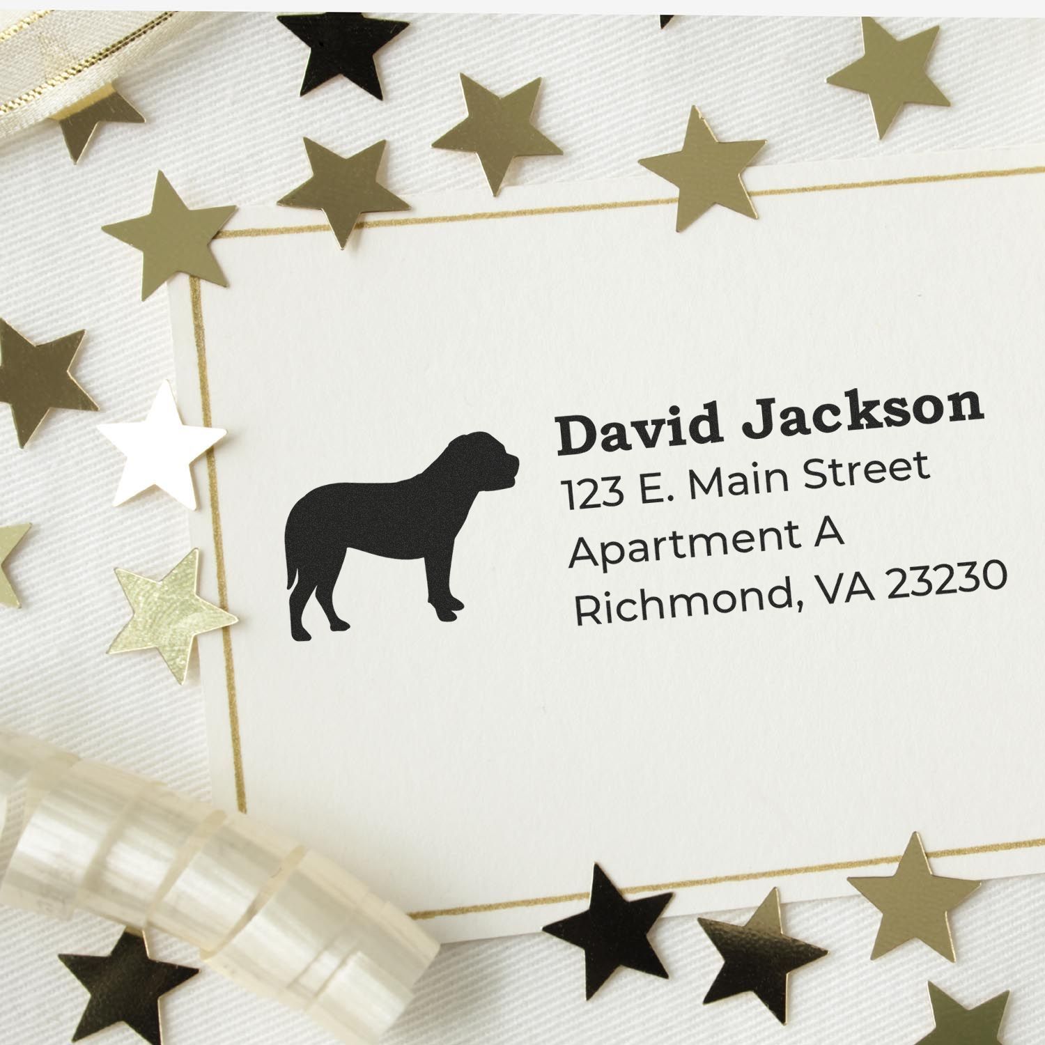 Custom dog silhouette address rubber stamp for pet lovers, showing a personalized return address on an envelope.